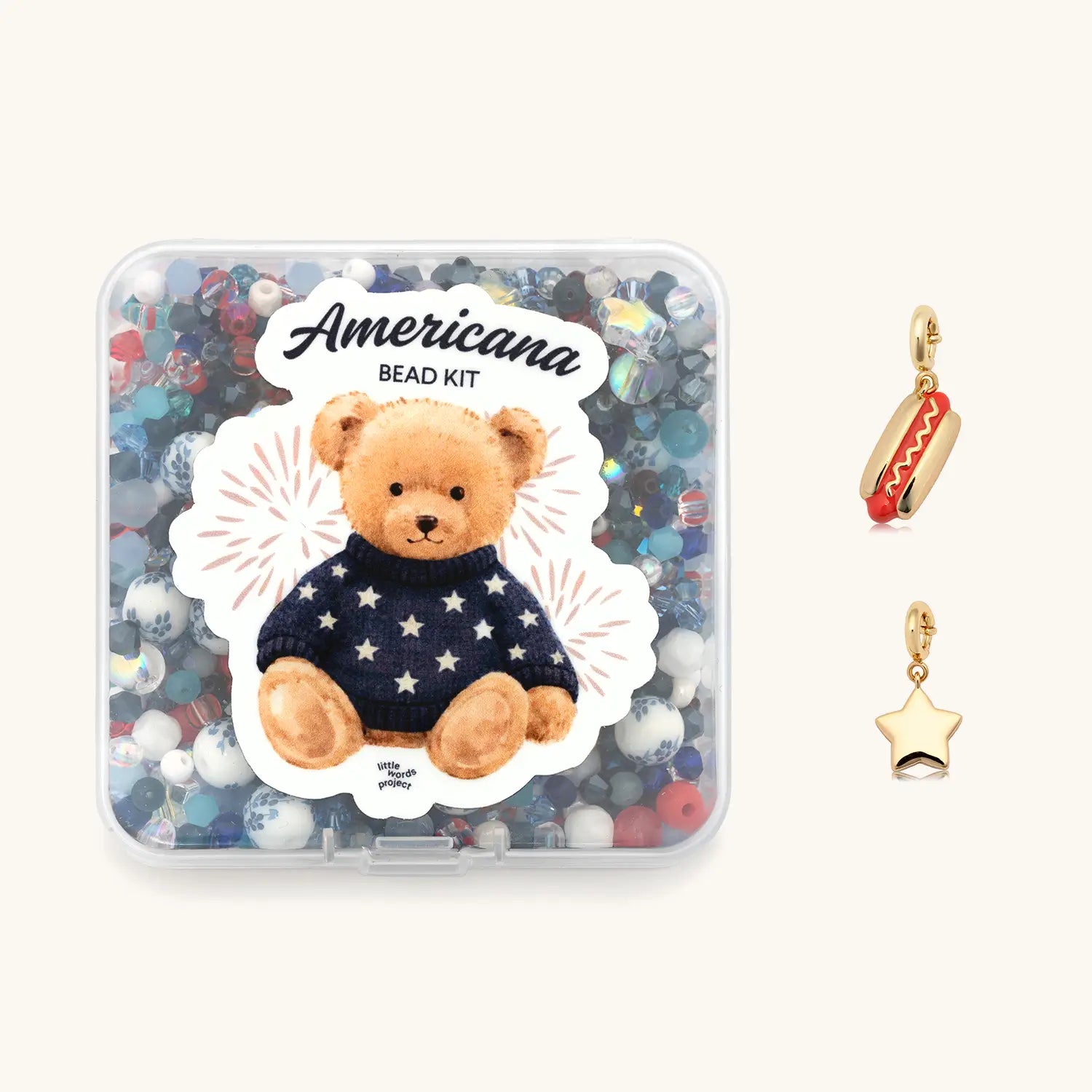 All American Bead Kit Set flat-lay showing the Americana Bead Kit and a hotdog charm styled together on a patriotic red, white, and blue background