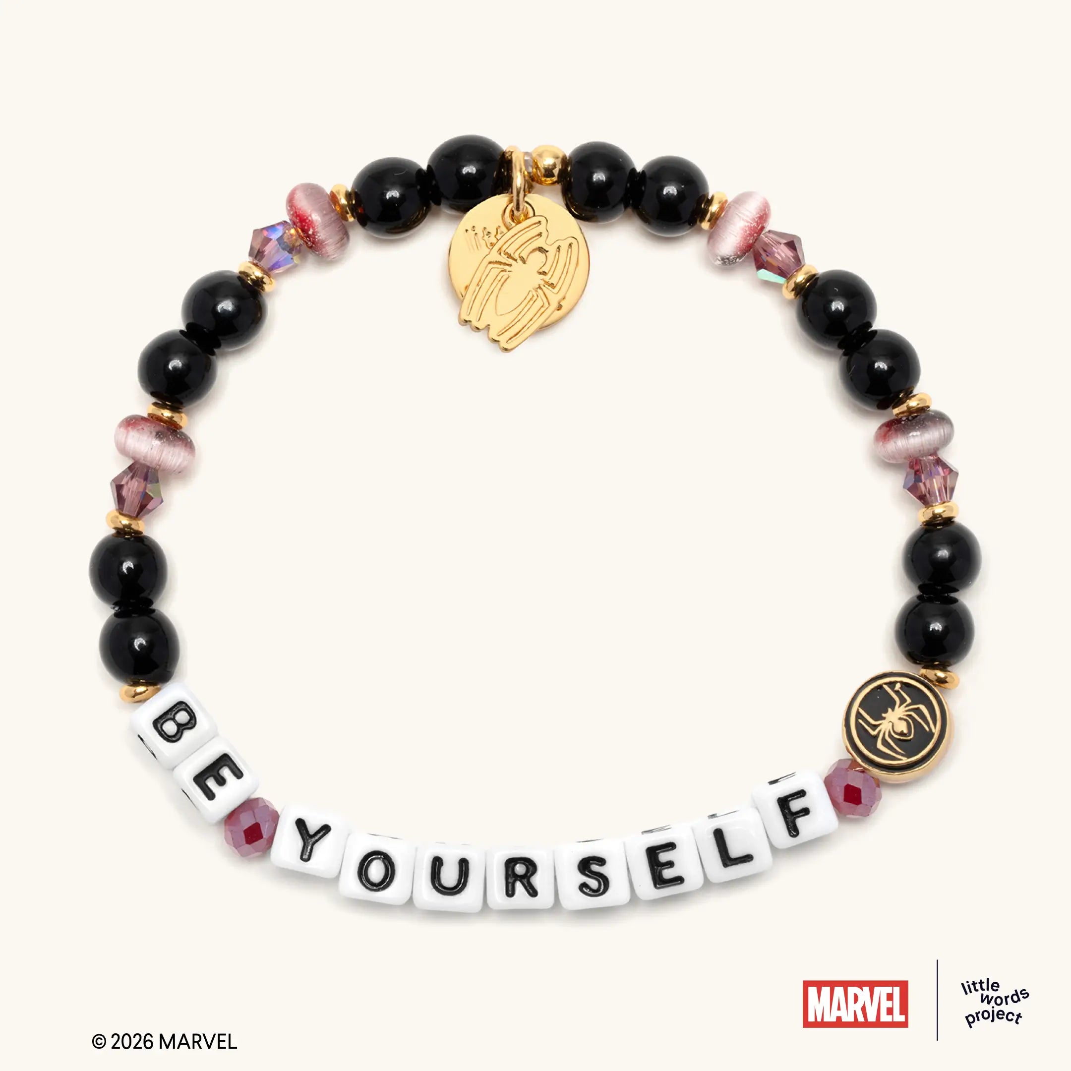 Be Yourself bracelet from Marvel's Spider-Man collection, flat-lay on white background, black glass beads with mauve cat eye beads and gold Spider-Man enamel casted bead