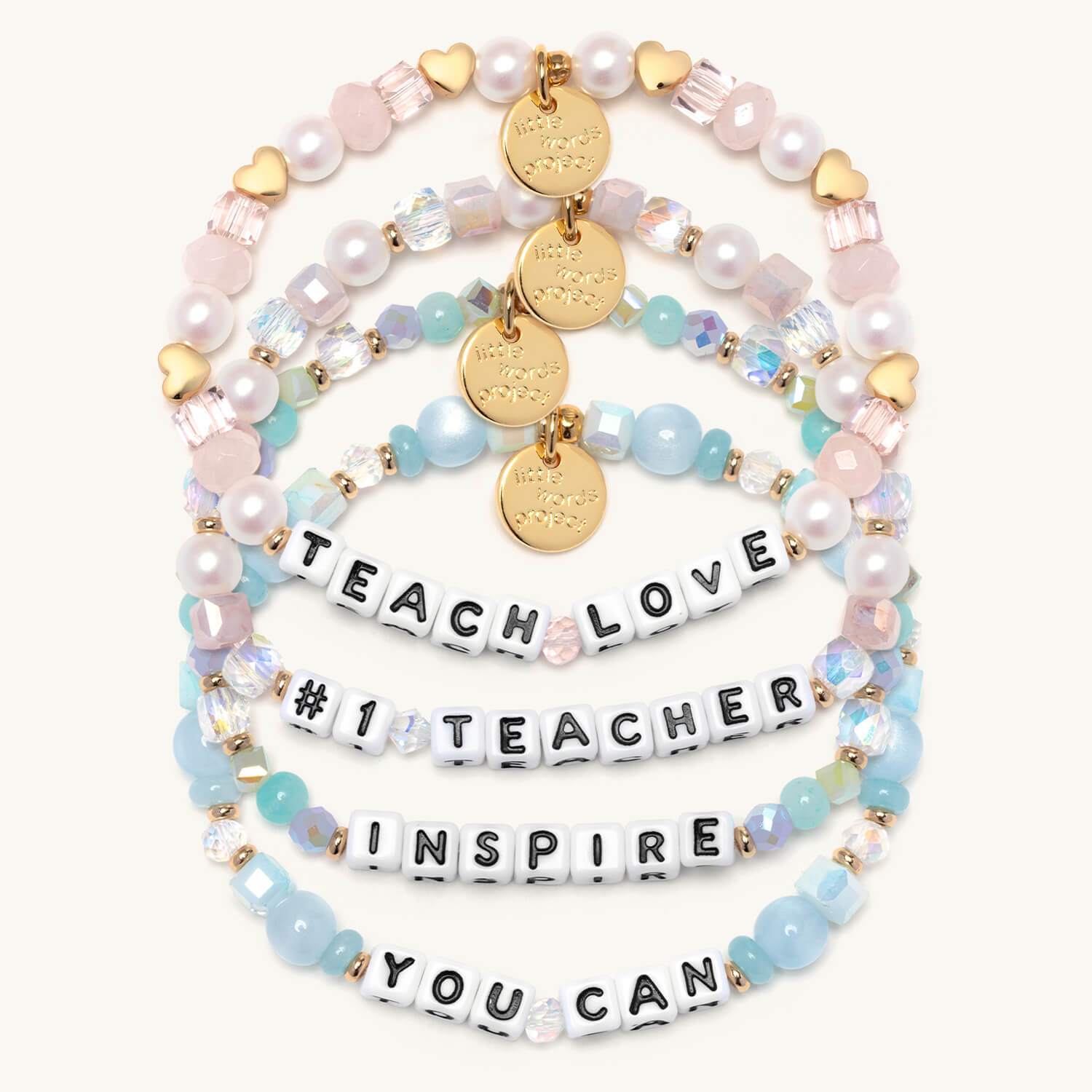Set of beaded bracelets with inspirational text on a white background