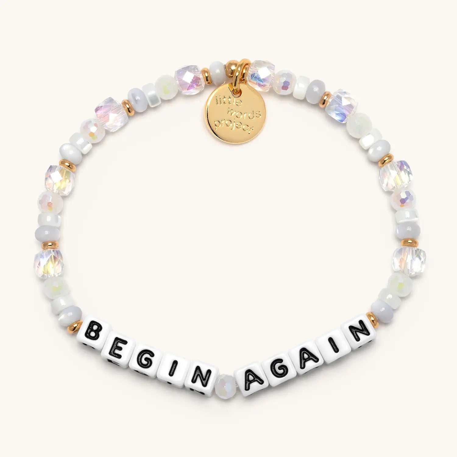 Begin Again — front flat-lay of beaded word bracelet in white and pastel beads