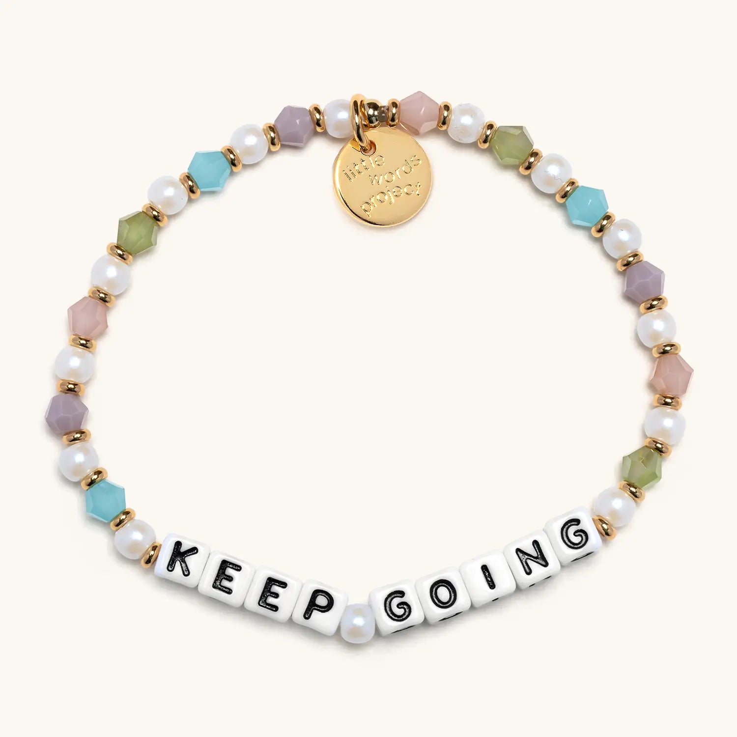 Multicolored beaded bracelet with 'KEEP GOING' message on a white background