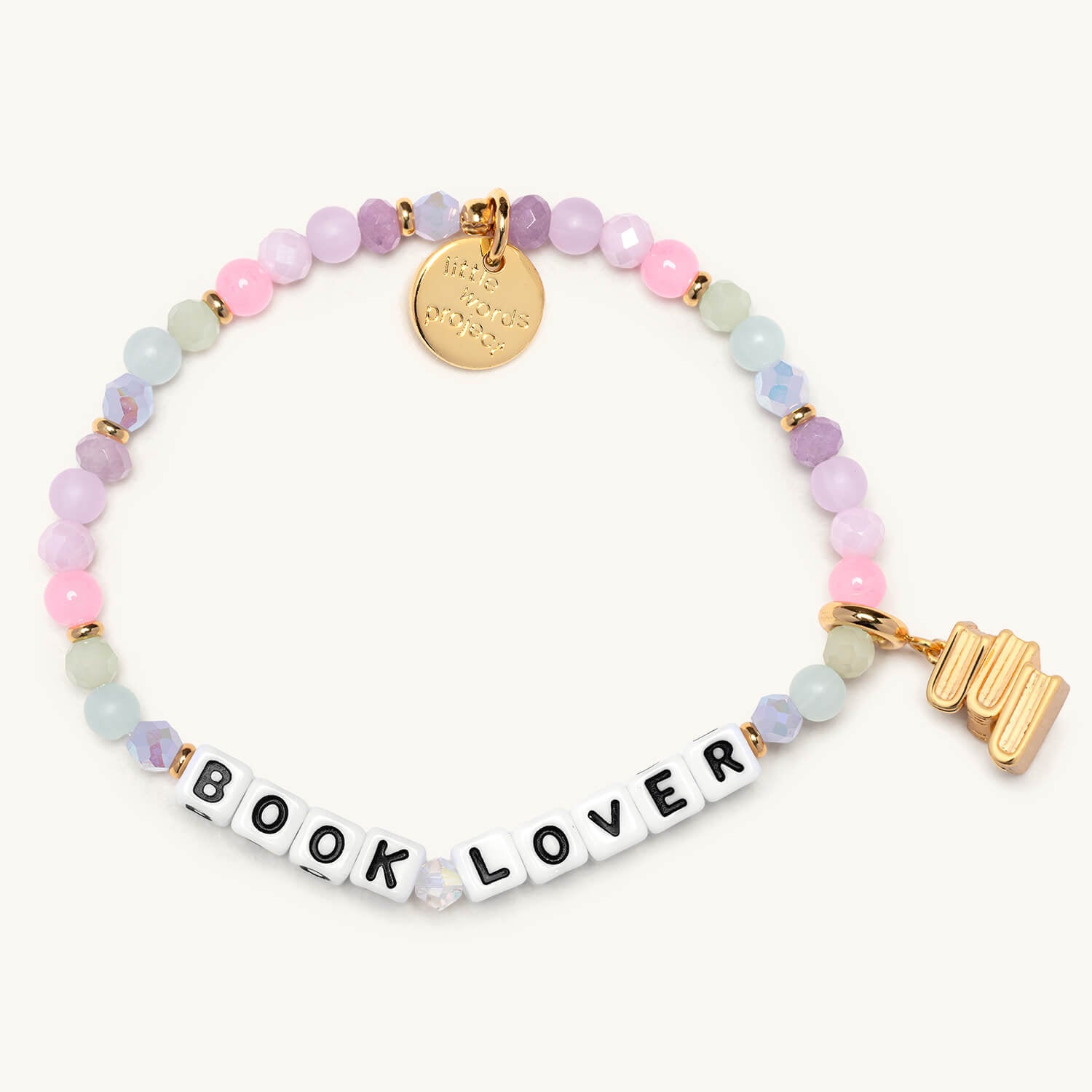 Bracelet with 'BOOK LOVER' charm and pastel beads on a white background