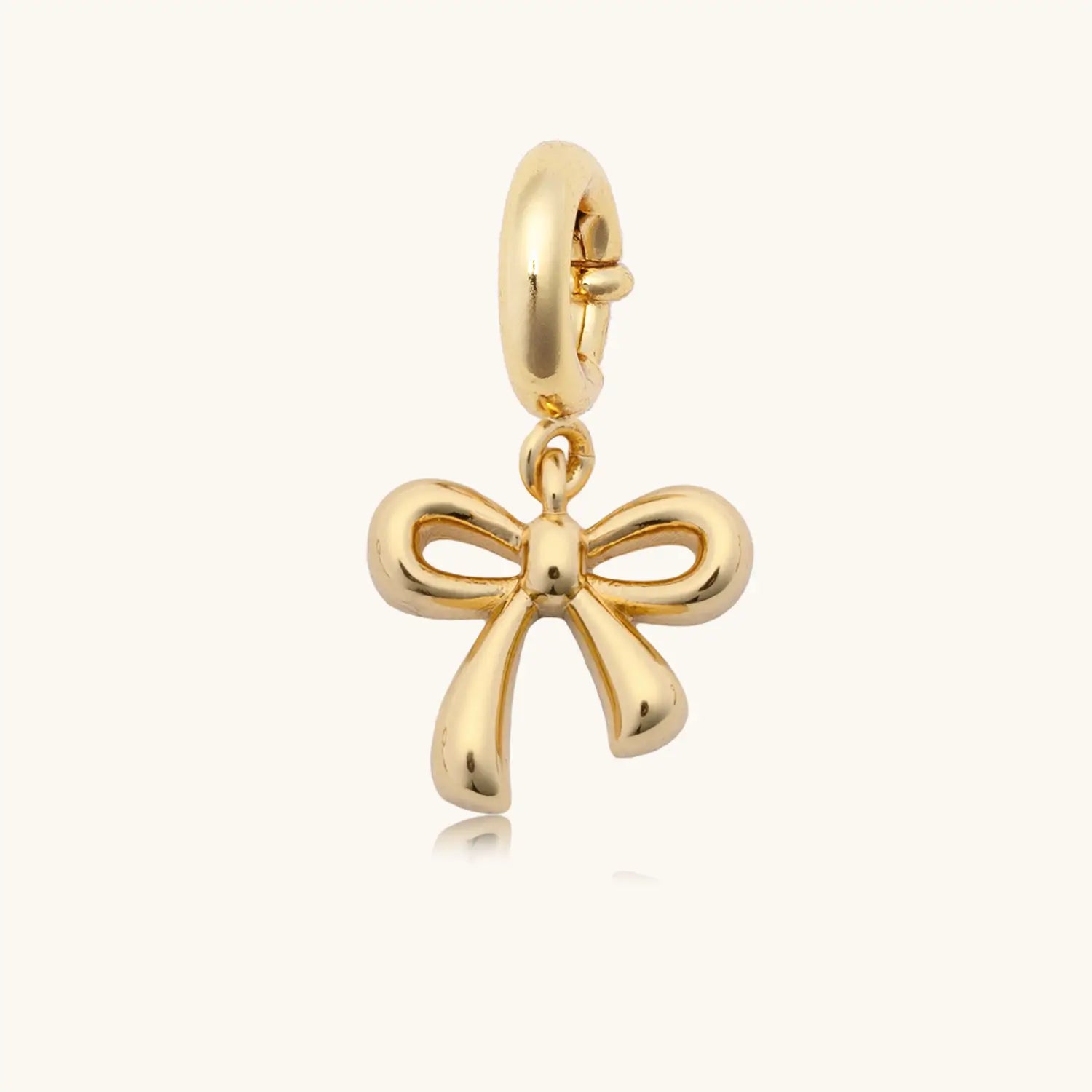 Bow Knot gold plated charm, flat lay