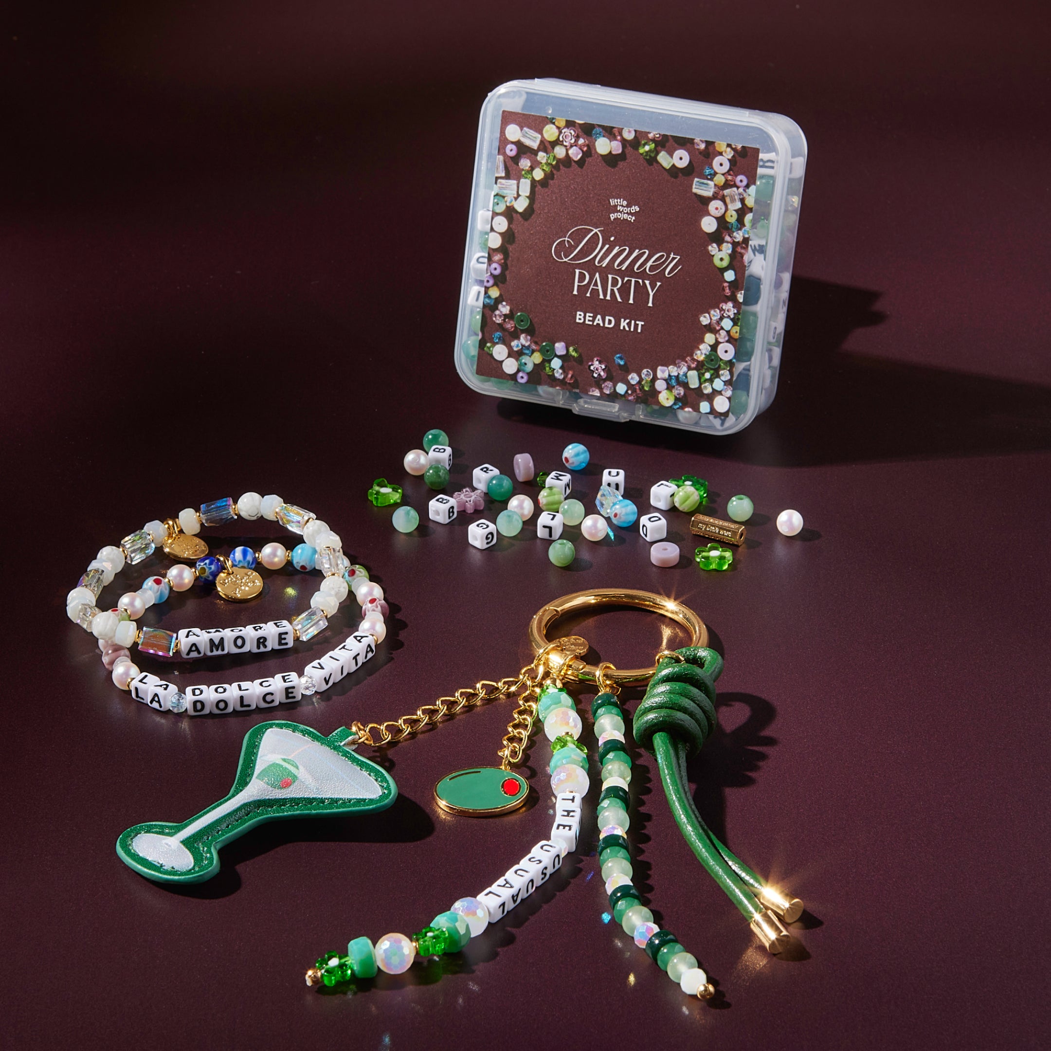 Dinner Party bead kit with jewelry-making items on a dark surface