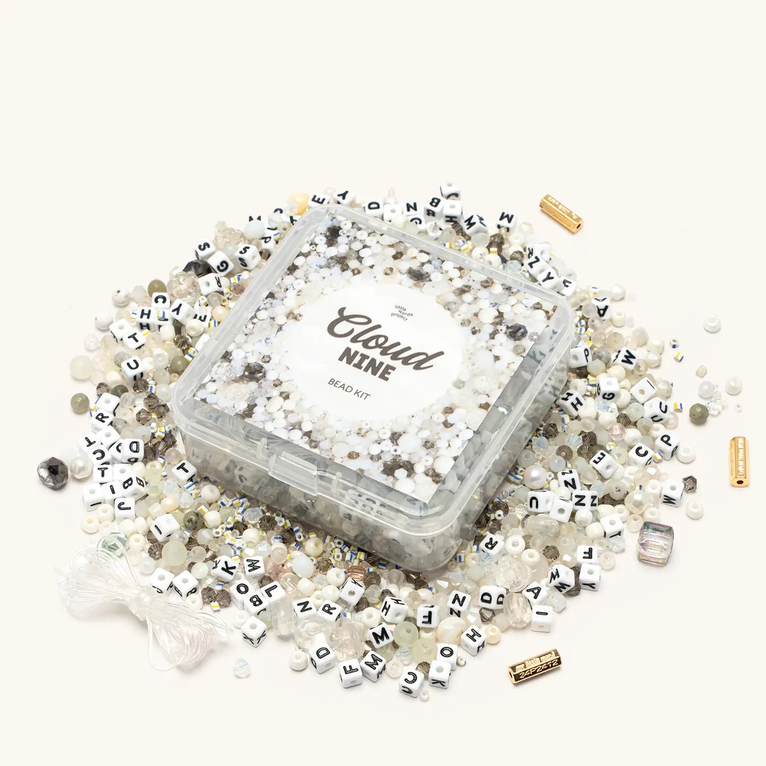 Cloud Nine Bead Kit — flat-lay of loose beads in soft blue, white, and cloud-inspired tones