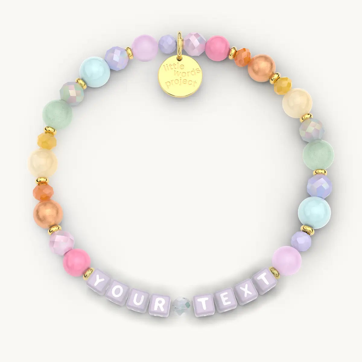 Colorful beaded bracelet with a gold tag and 'Your Text' section on a white background