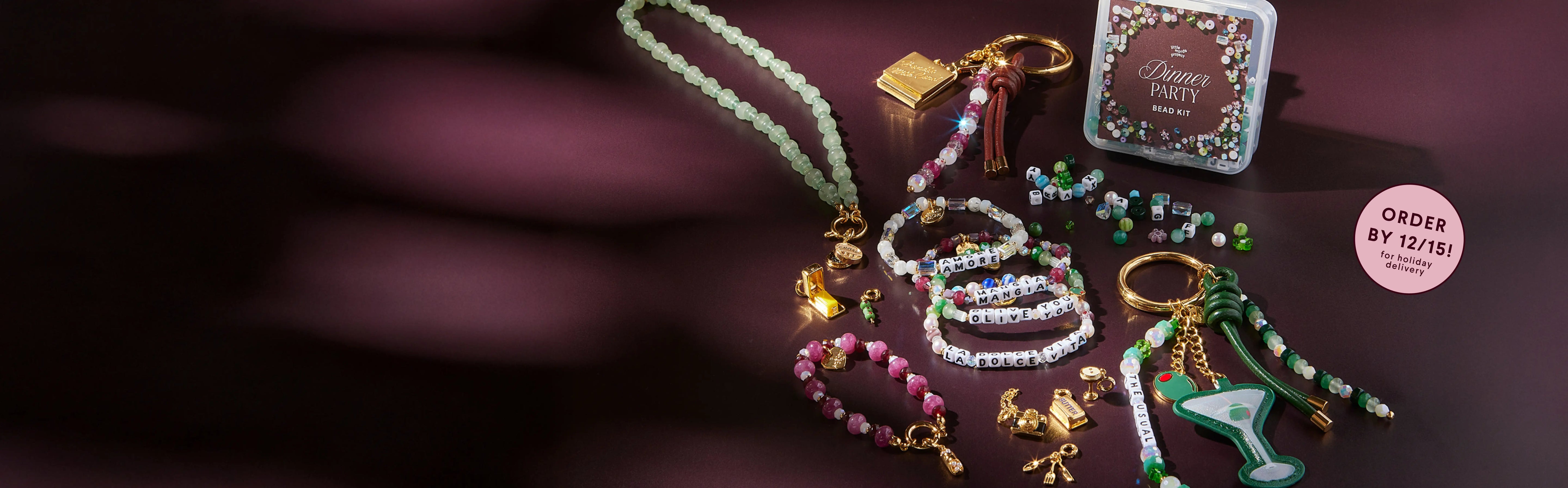 Decorative keychains and beads on a dark surface.