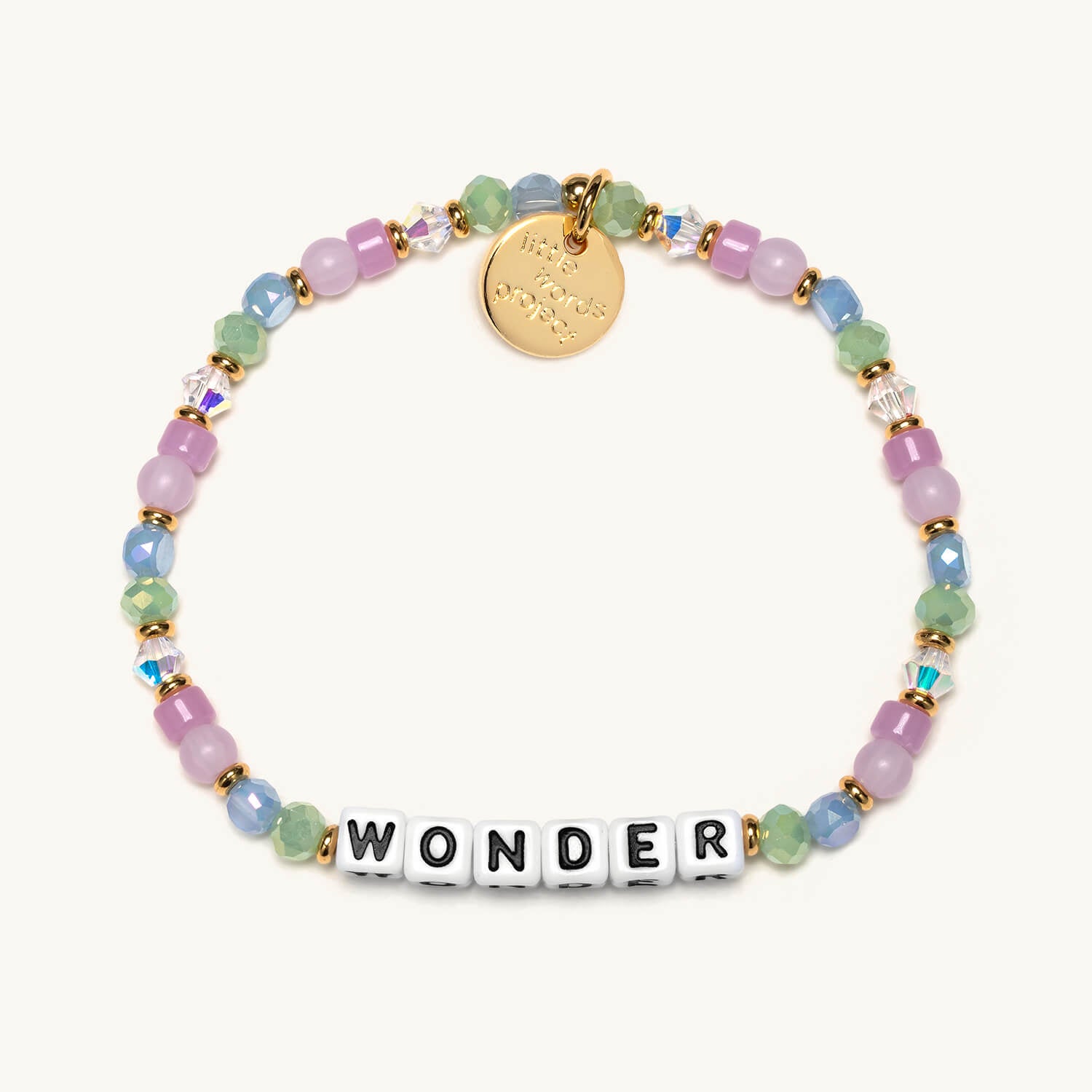 Multicolored beaded bracelet with a gold tag and 'WONDER' word on a white background