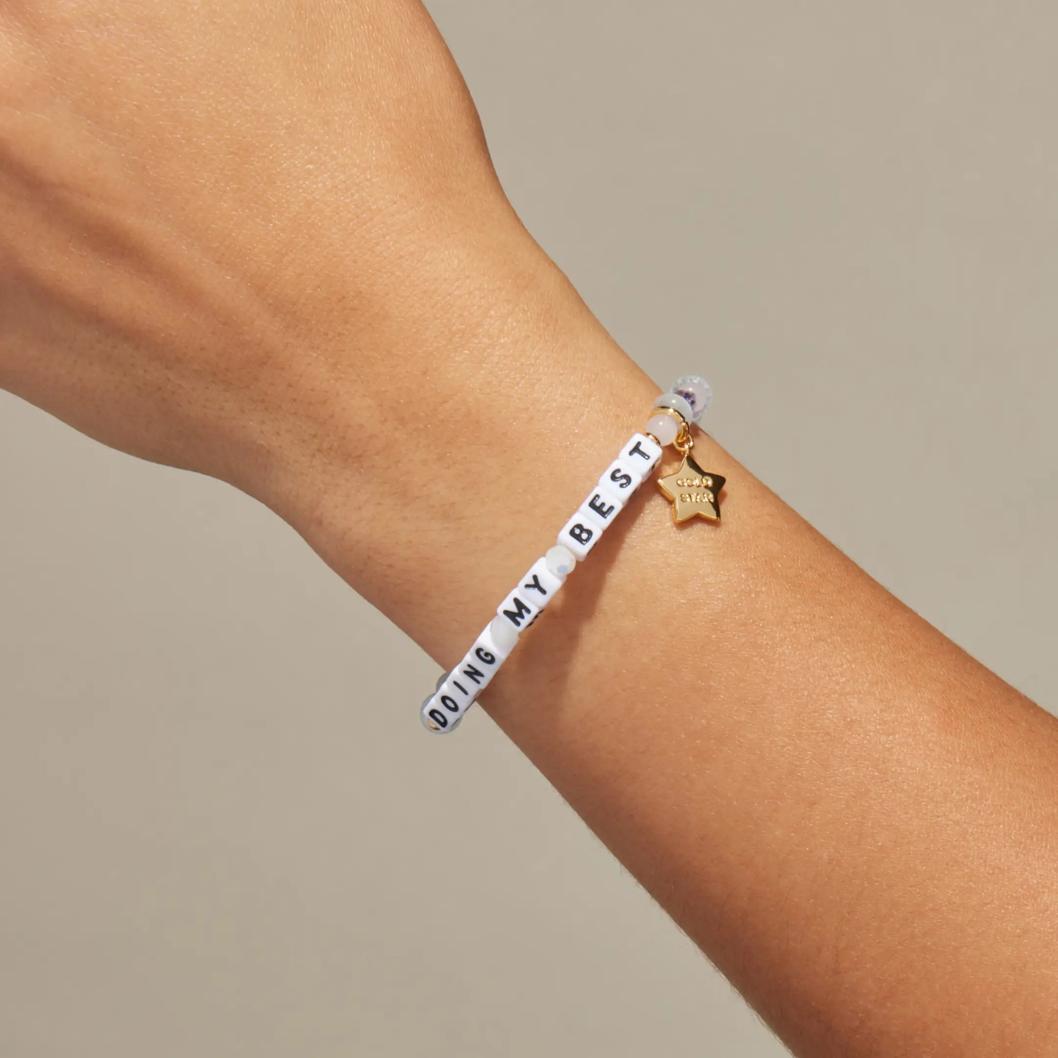 Doing My Best bracelet worn on wrist, on-model