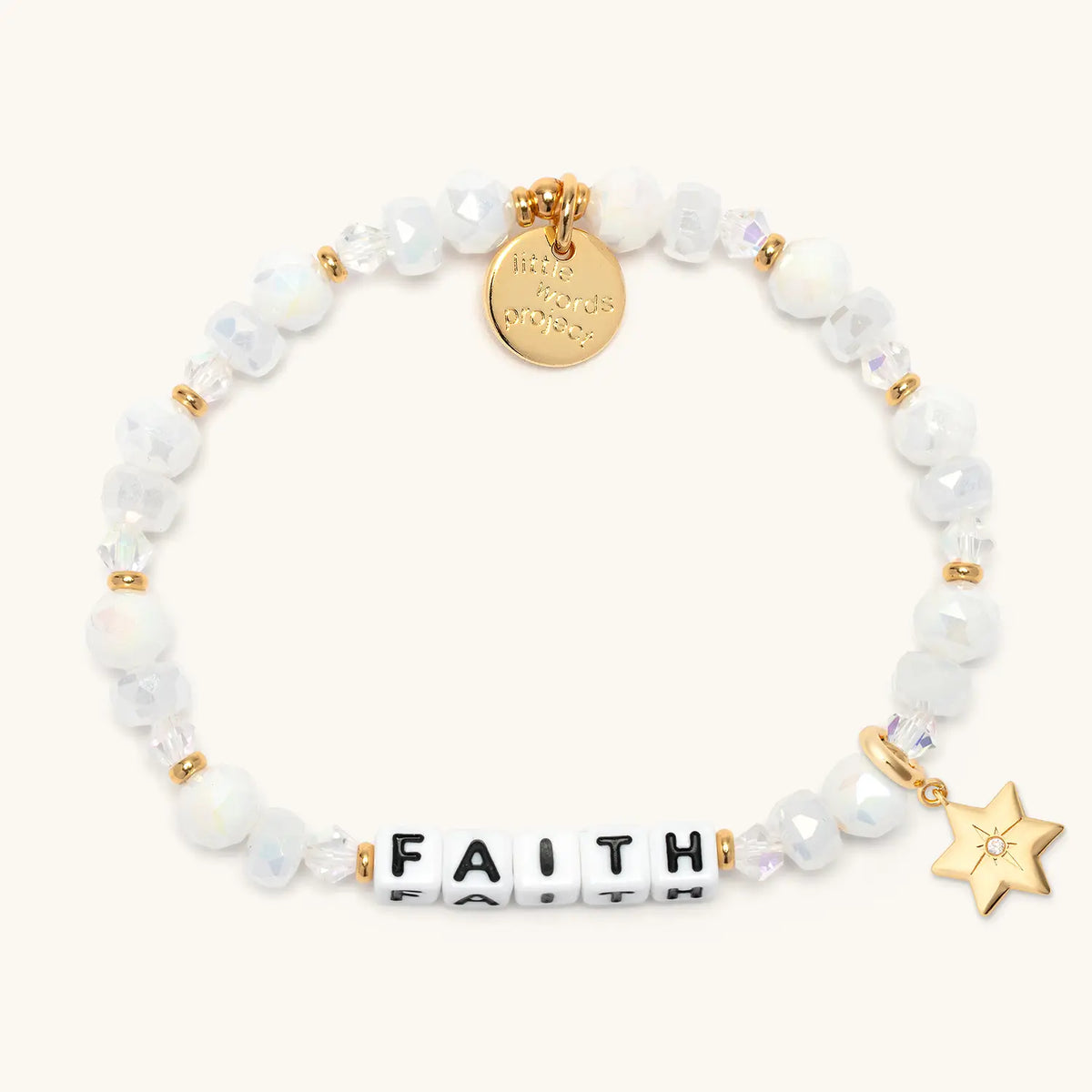 Faith bracelet in the Snowflake Sparkle bead pattern with white letter beads, gold puffy Star of David charm with a clear CZ stone, flat-lay on cream background