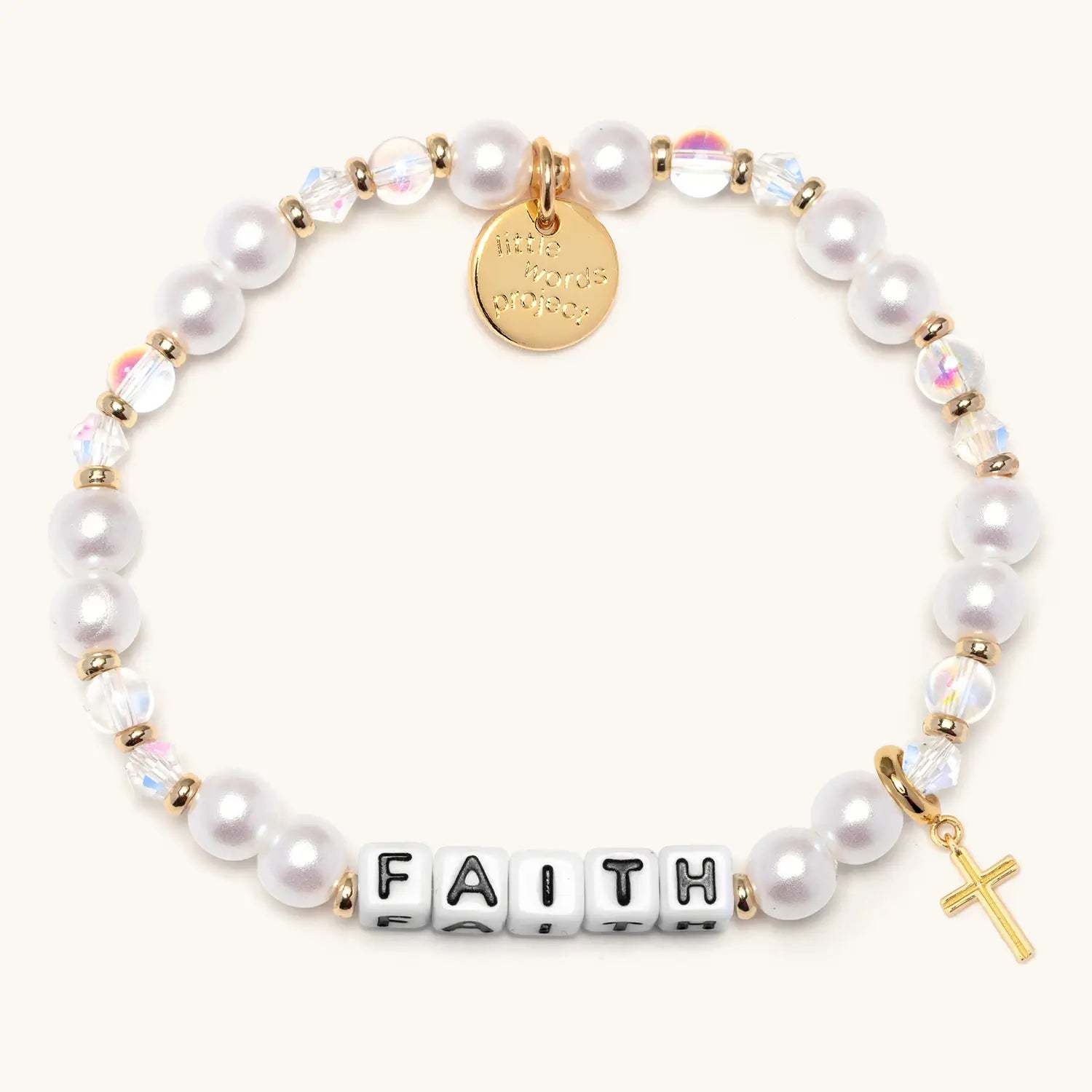 Pearl bracelet with gold accents, 'FAITH', and a cross charm on a white background