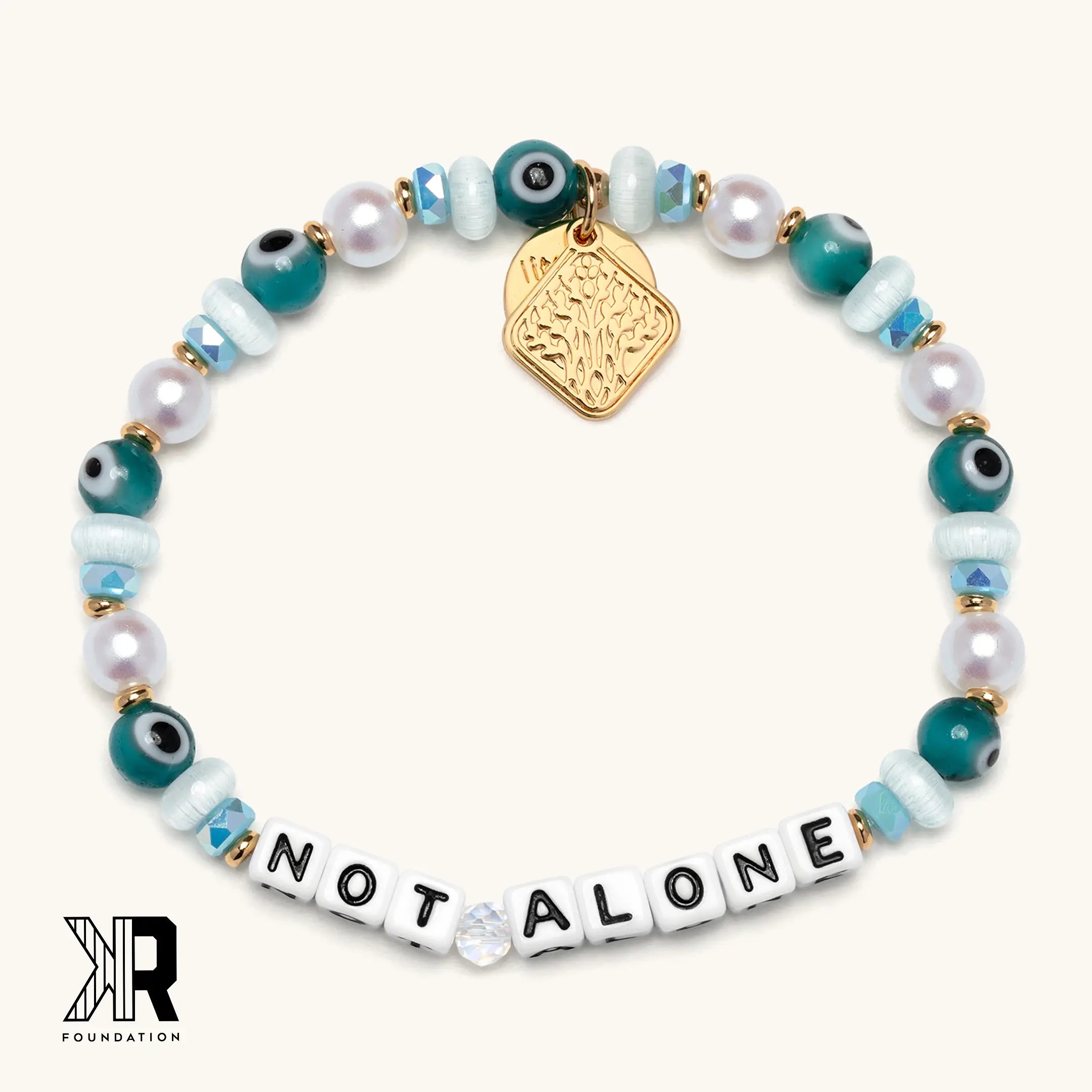 Bracelet with beads and a gold tag on a white background