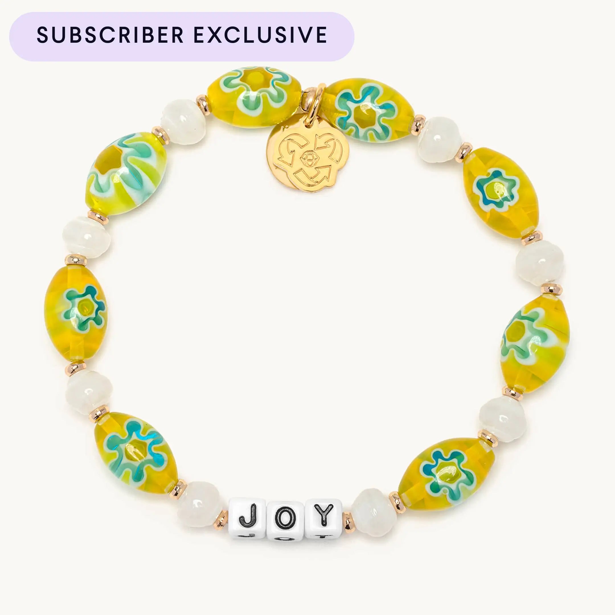 Colorful beaded bracelet with 'JOY' on a white background