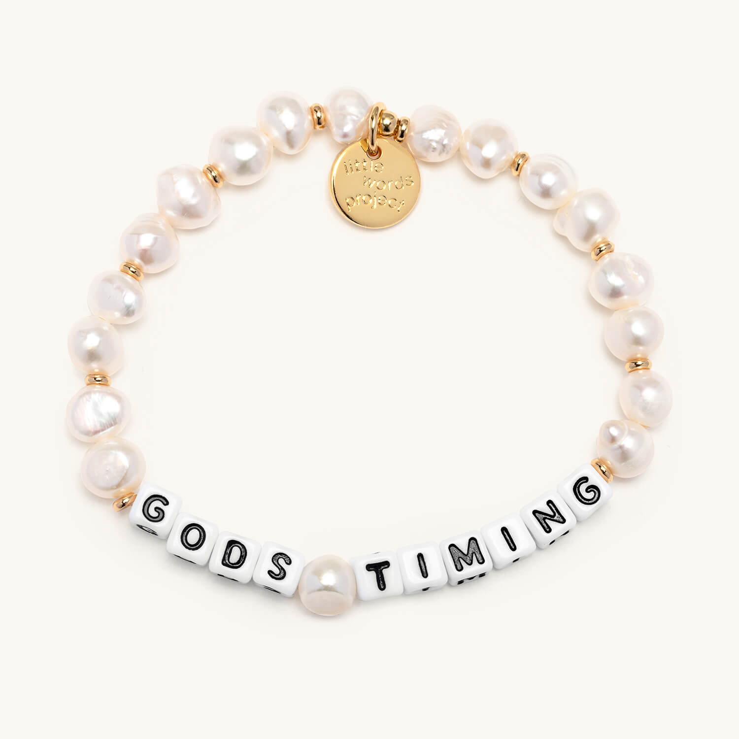 Pearl bracelet with 'GODS TIMING' on a white background