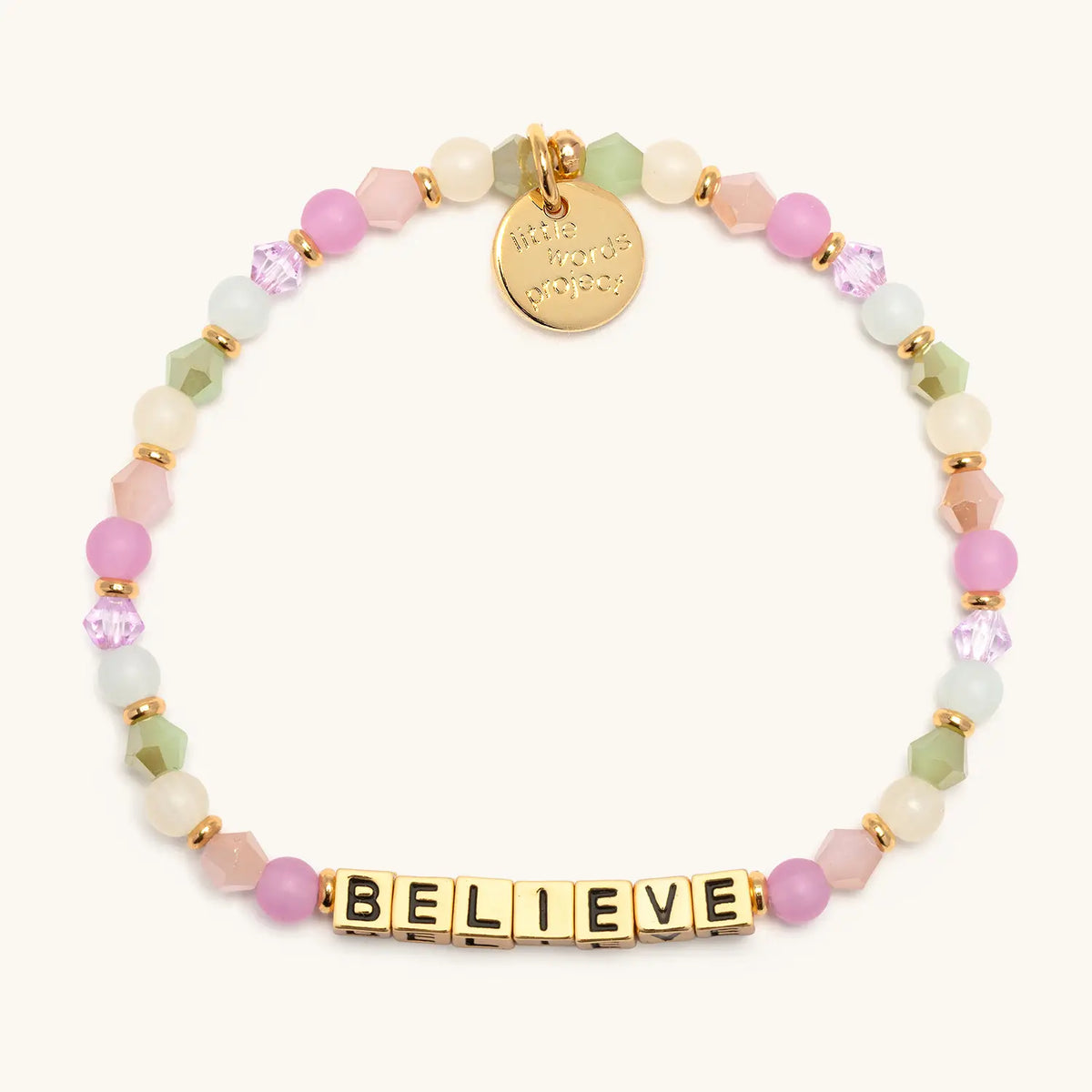 Believe bracelet with gold letter beads from the Good Things Ahead Bracelet Set, flat-lay on cream background