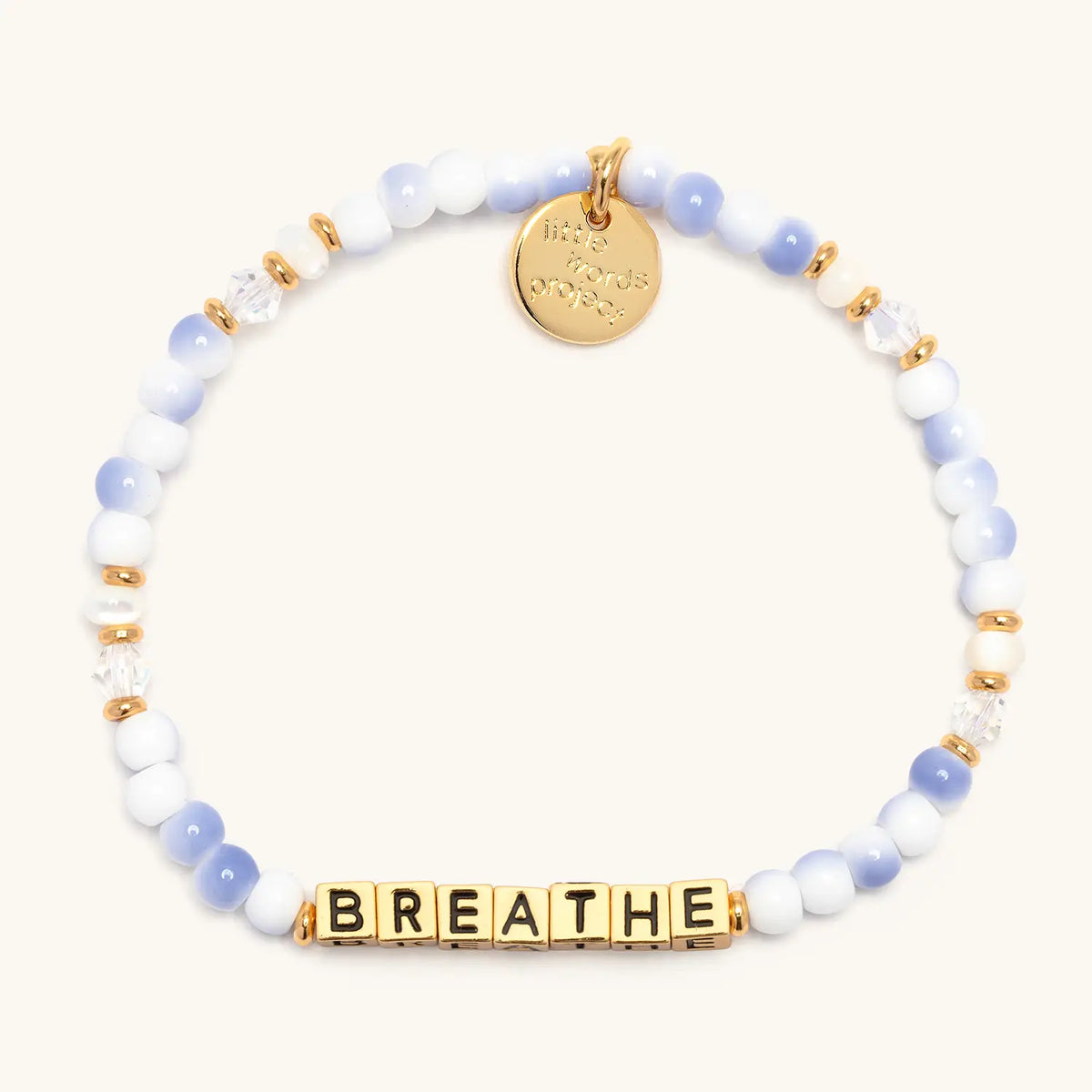 Breathe bracelet with gold letter beads from the Good as Gold Bracelet Set, flat-lay on cream background