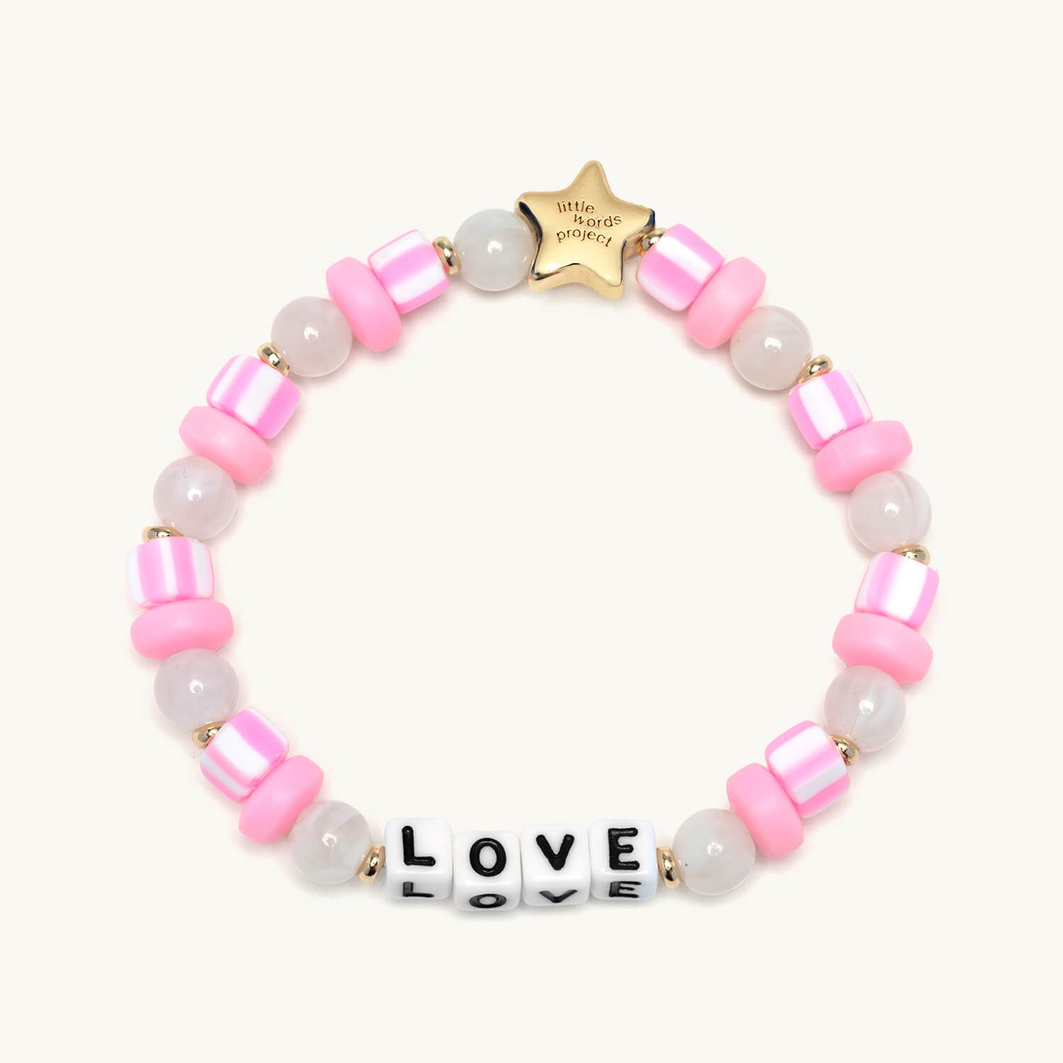 Bracelet with pink beads and 'LOVE' block beads on a white background