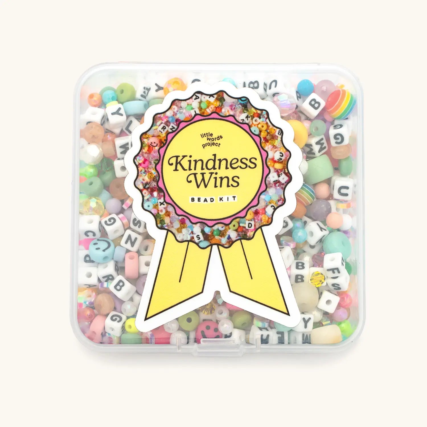 Front of Kindness Wins Bead Kit packaging with branding and product name on a colorful background