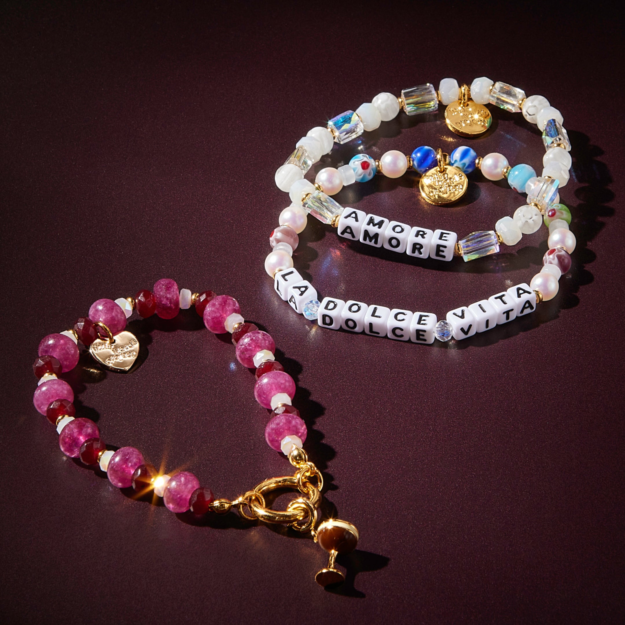 Three beaded bracelets on a dark background
