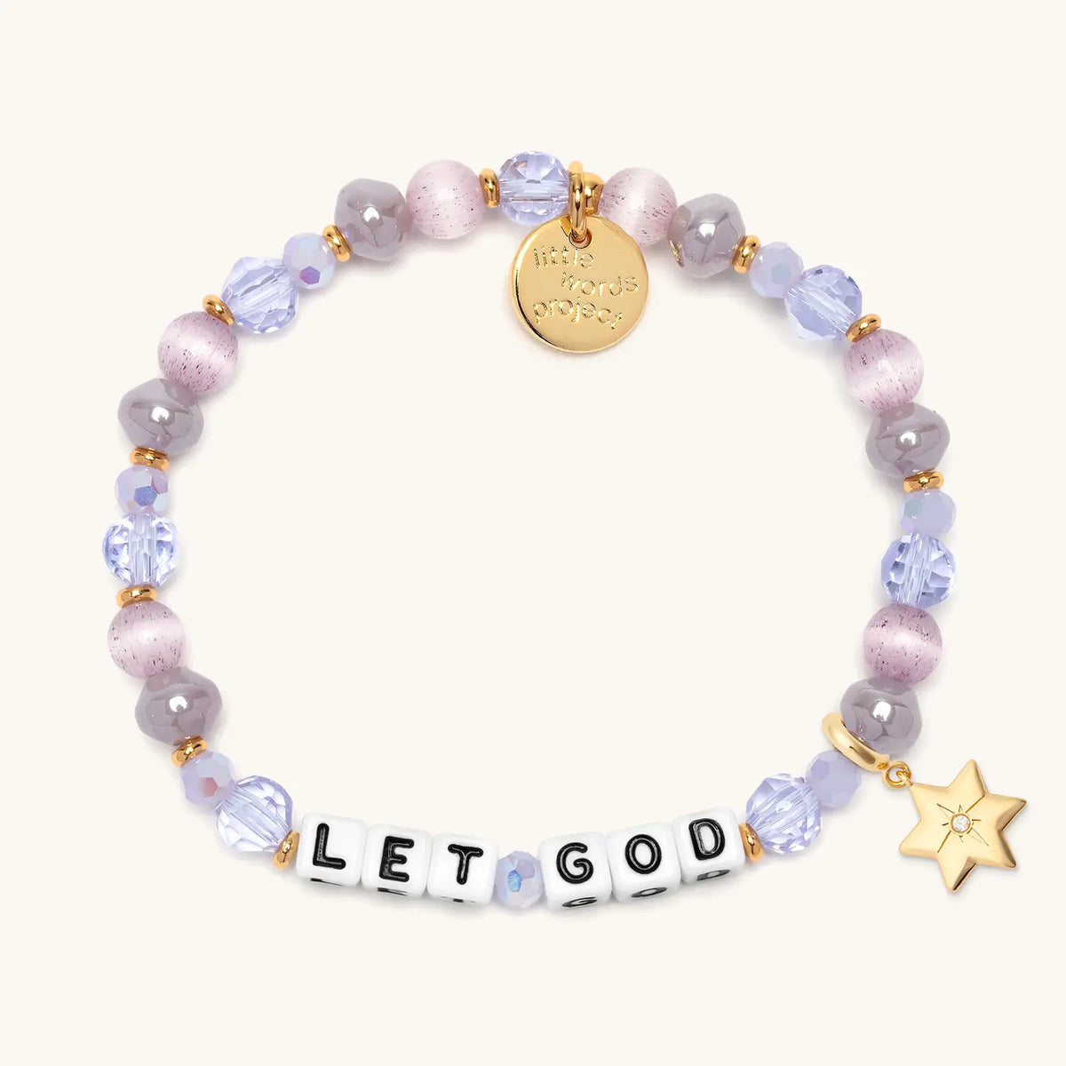 Let God bracelet in the Purple Twinkle bead pattern with white letter beads, gold puffy Star of David charm with a clear CZ stone, flat-lay on cream background
