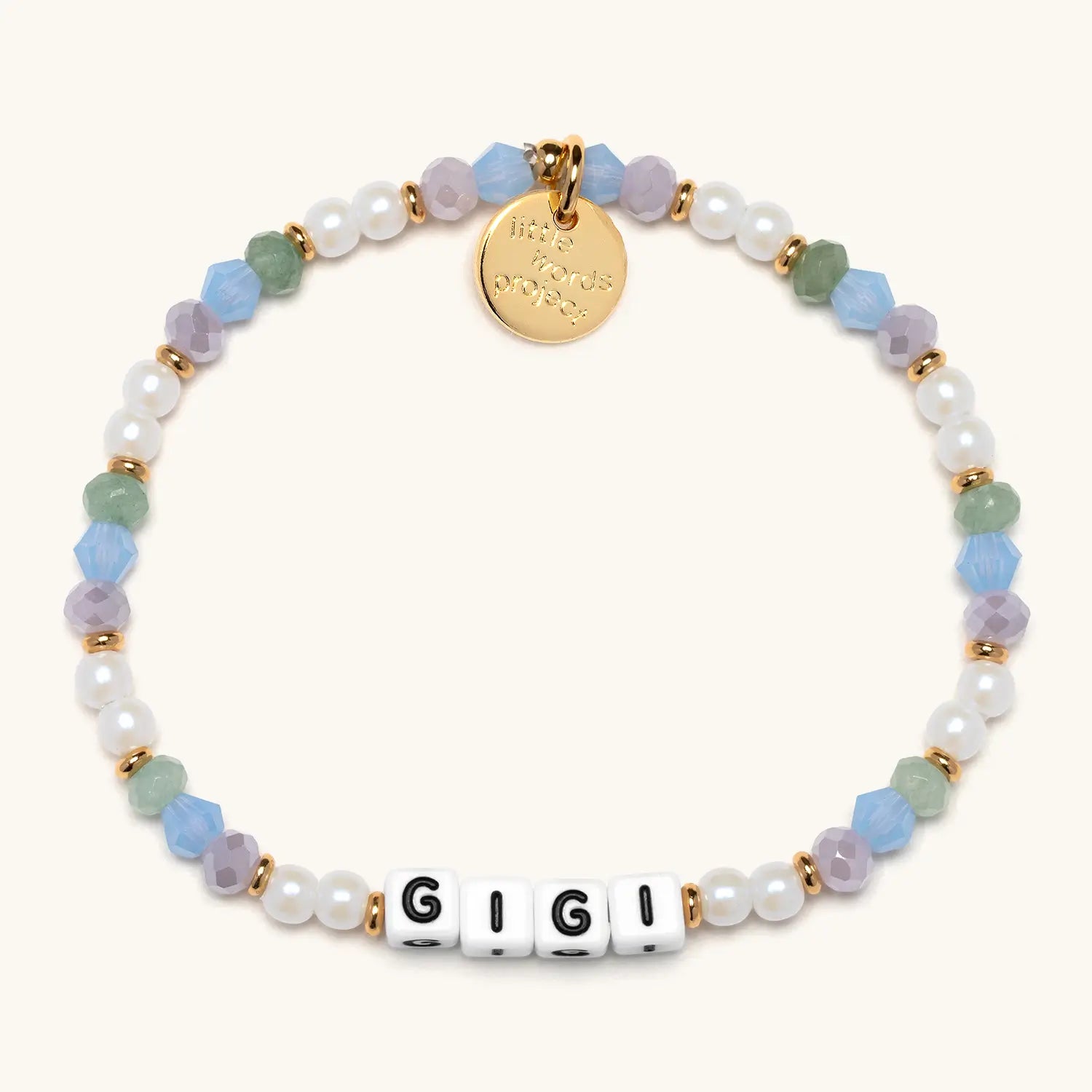 Multicolored beaded bracelet with a gold tag and 'GIGI' on a white background