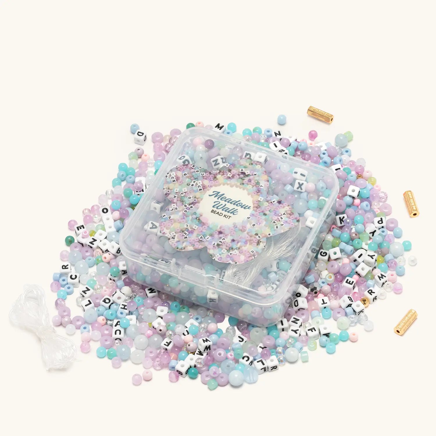 Meadow Walk Bead Kit — flat-lay of loose beads in green, ivory, and floral tones