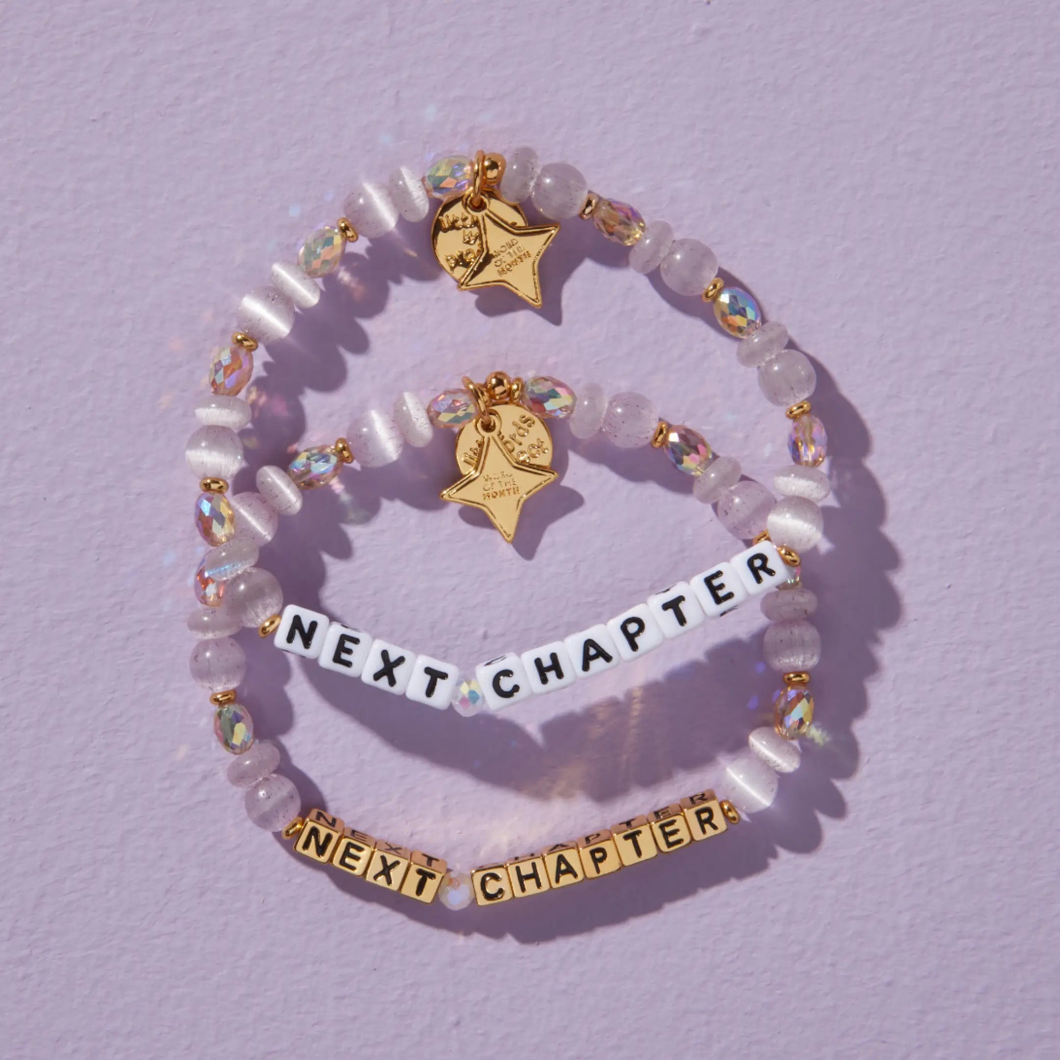 Bracelet withs 'Next Chapter' on a light purple background