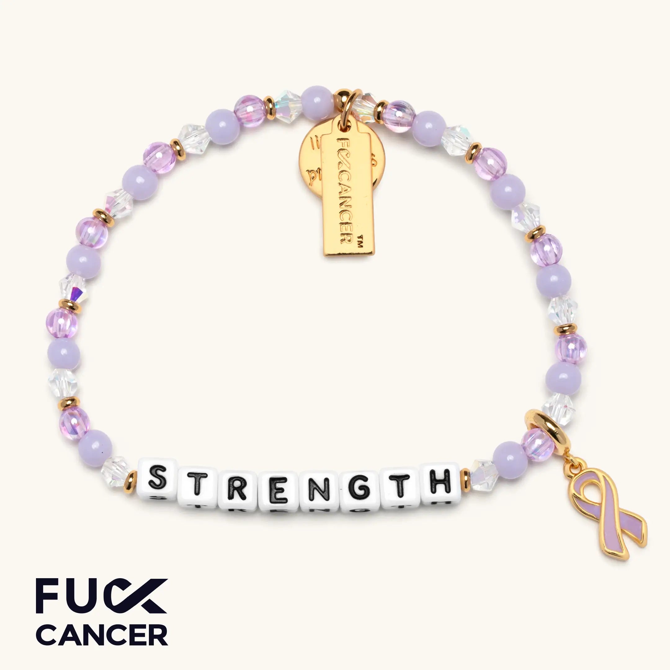 Bracelet with 'STRENGTH', purple ribbon charm, and gold tag on a white background
