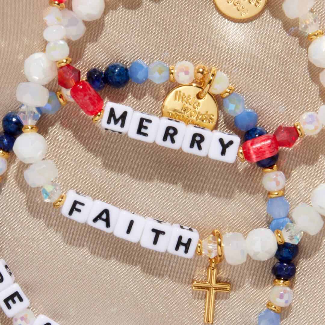 Colorful beaded bracelet with 'Merry Faith' words on a beige background