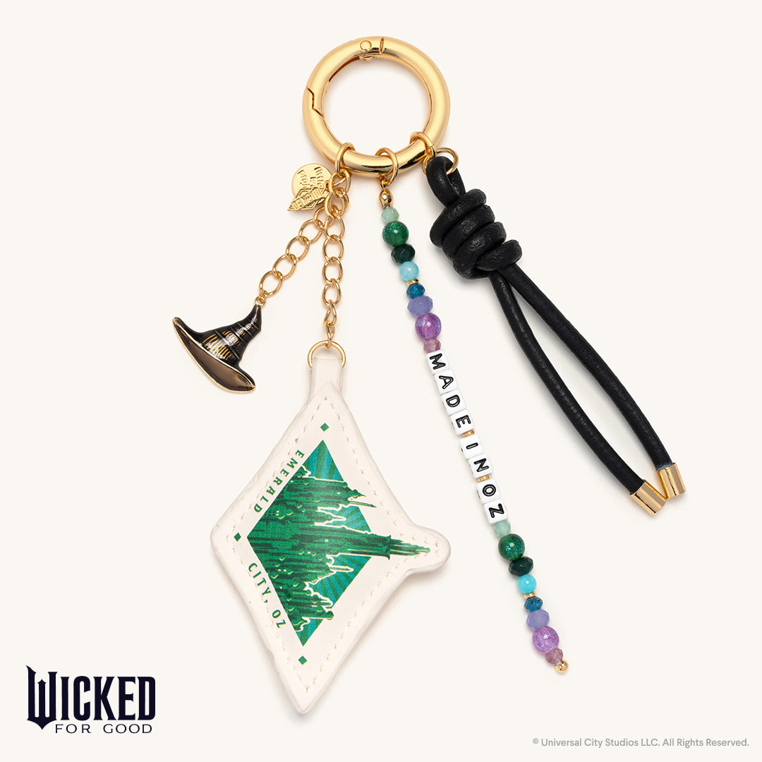 Keychain with decorative elements and 'Wicked' branding on a white background