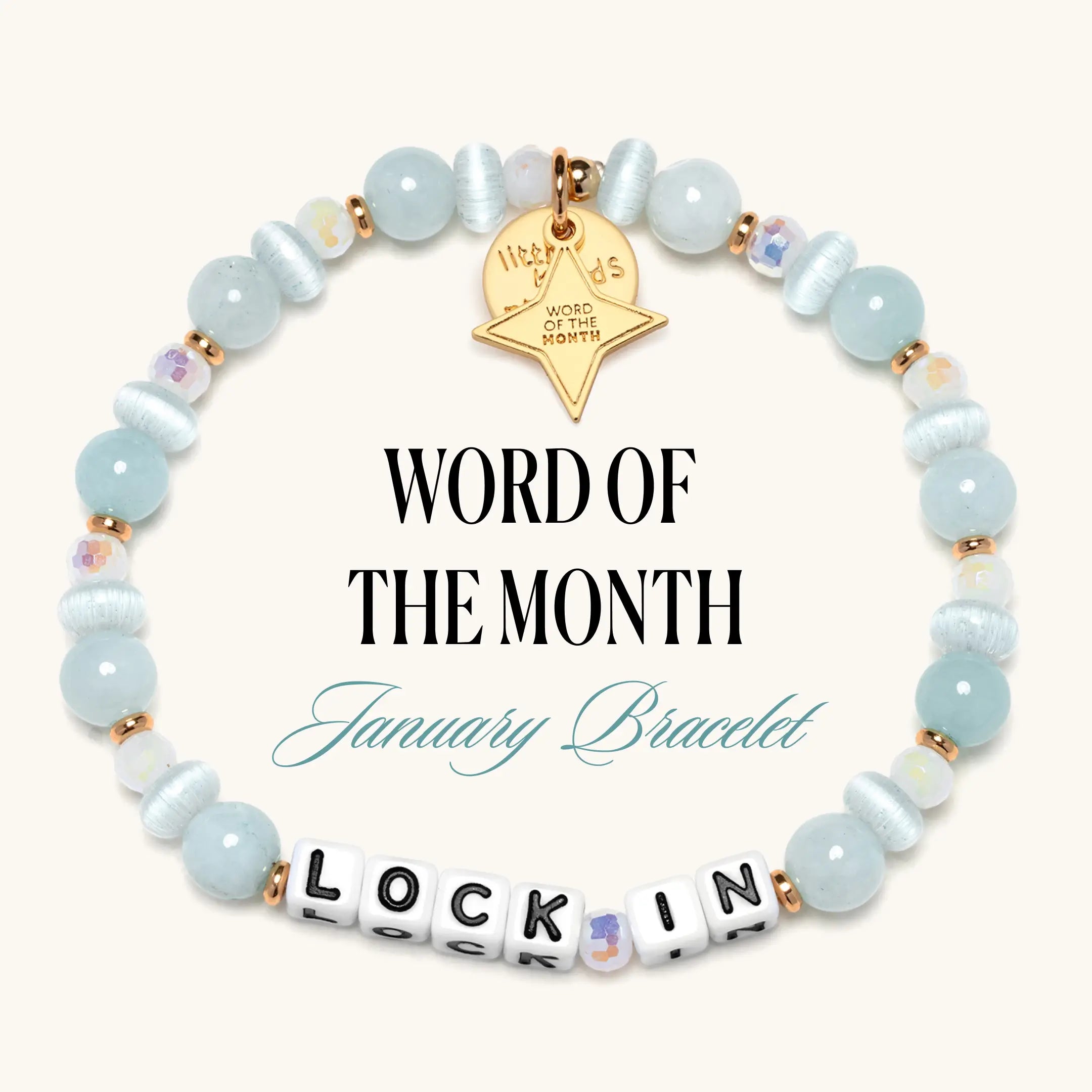 Bracelet with light blue beads and a gold tag on a white background