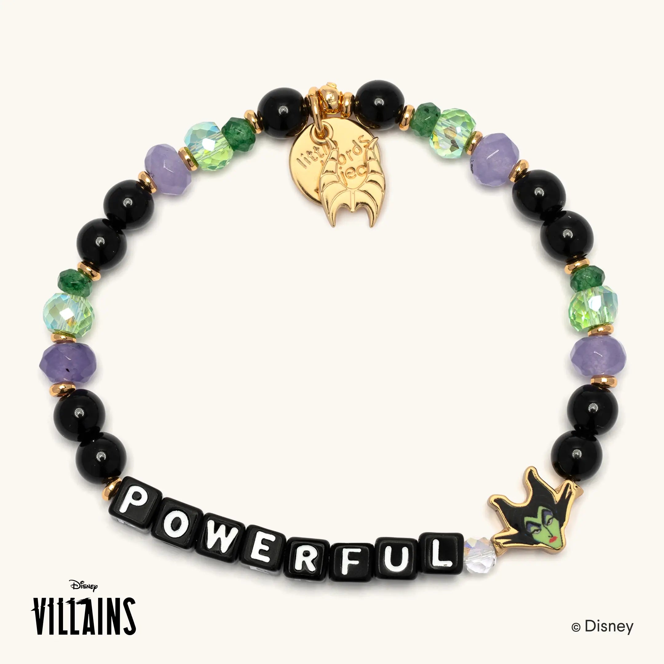 Powerful Disney Villains bracelet featuring Maleficent, with black, green and lavender beads, black letter beads spelling POWERFUL, a gold horned charm and an enamel Maleficent charm.