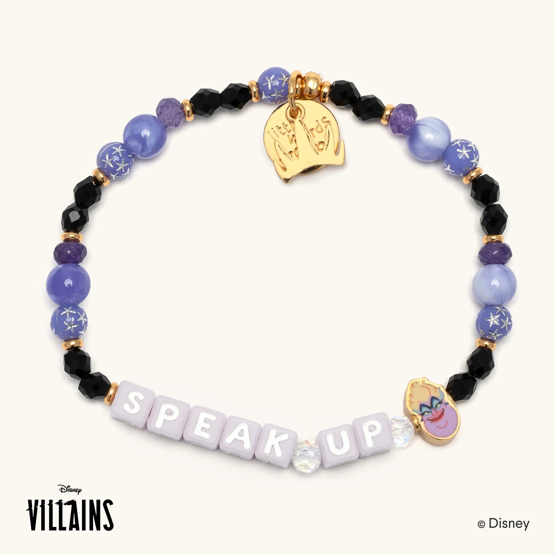 Speak Up Disney Villains bracelet featuring Ursula, with periwinkle, purple and black beads, lilac letter beads spelling SPEAK UP, a gold Little Words Project charm and an enamel Ursula charm.