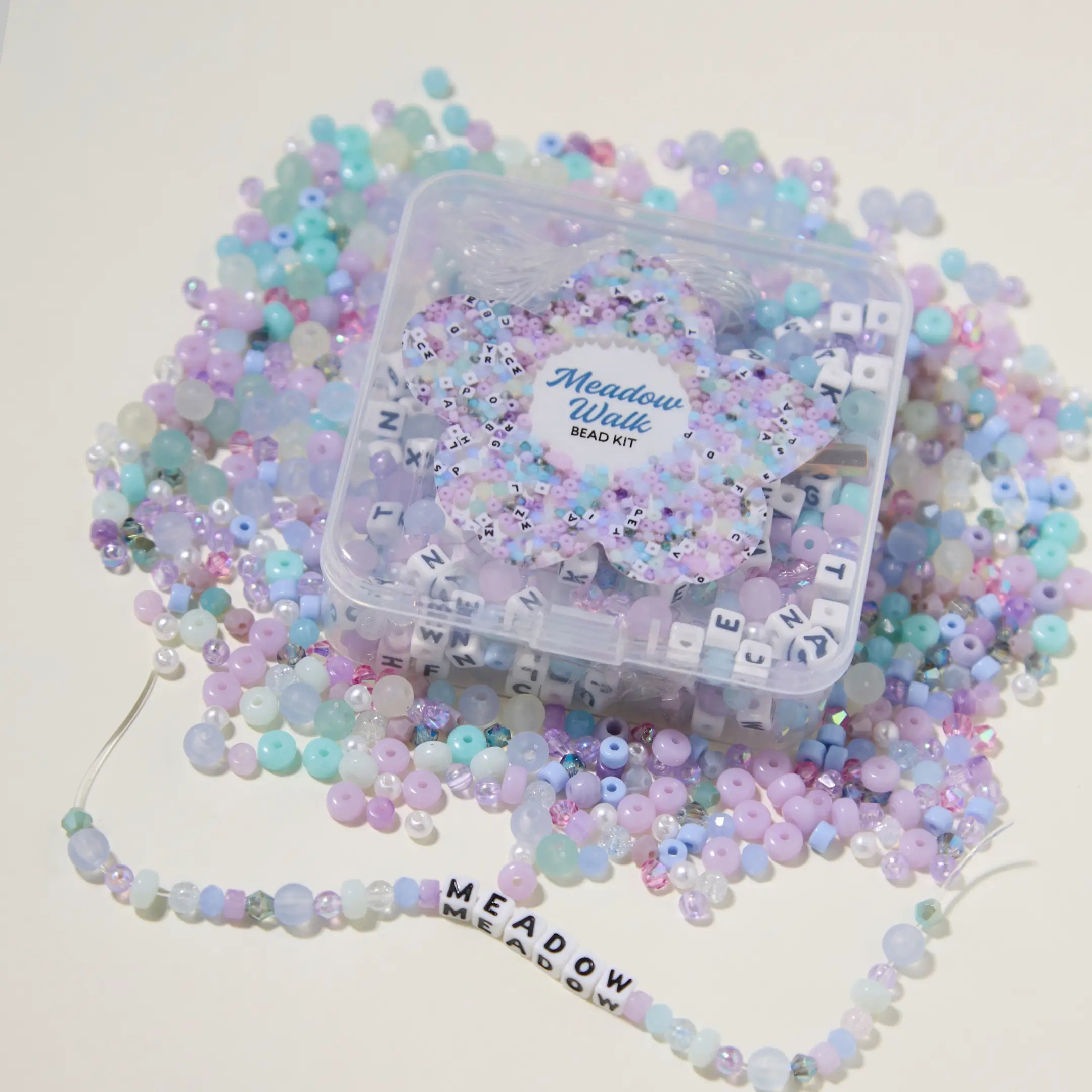 Pastel bead kit with a clear container labeled 'Meadow Walk' on a white background.