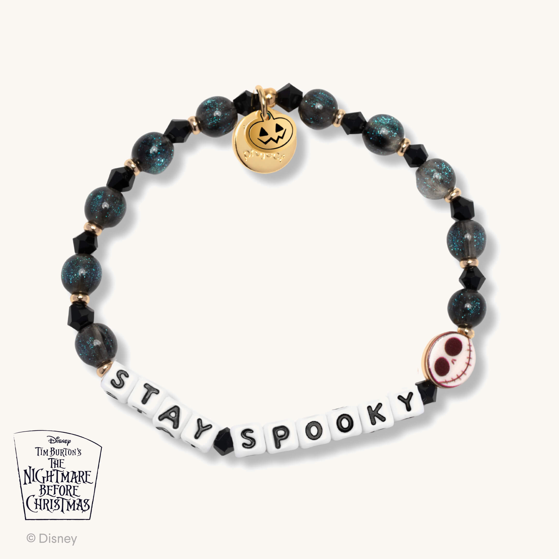 Bracelet with 'Stay Spooky' charm and black beads on a white background