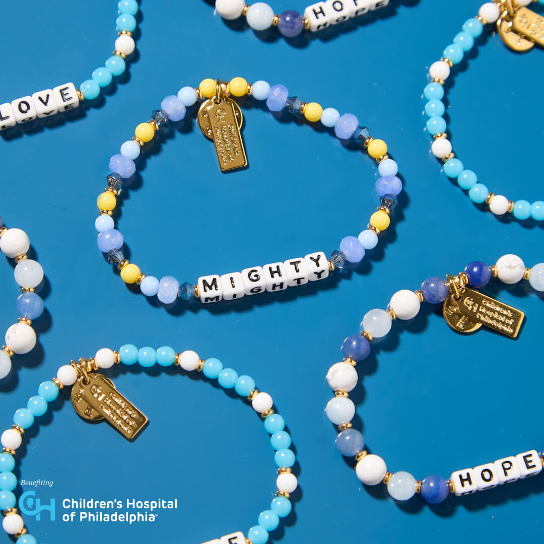 Bracelets with beads and charms on a blue background, featuring 'Children's Hospital of Philadelphia' branding.