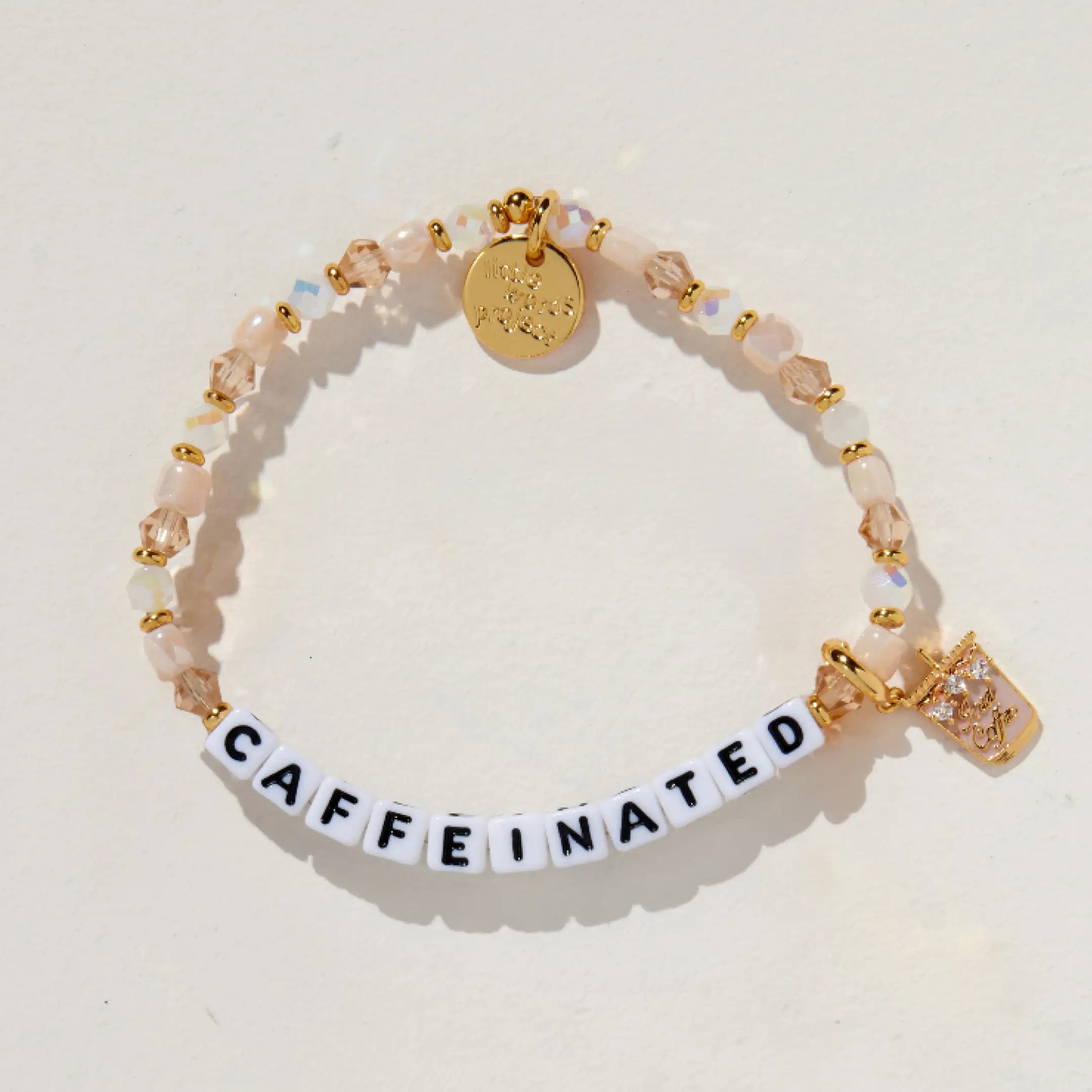 Bracelet with 'CAFFEINATED' on a light background
