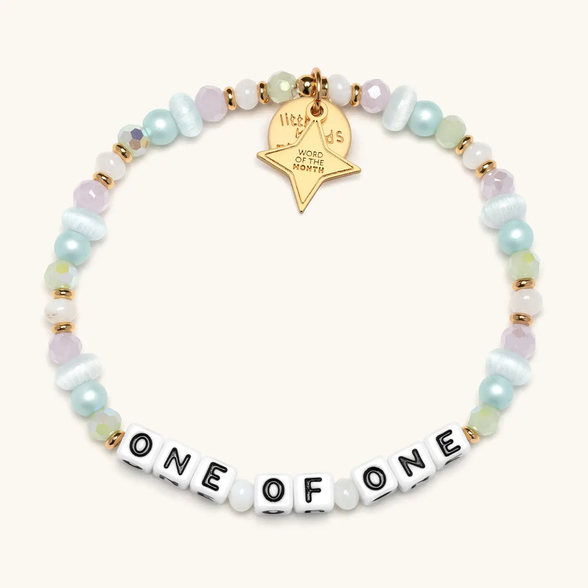 One Of One July WOTM bracelet with white beads and silver hardware, product flat-lay