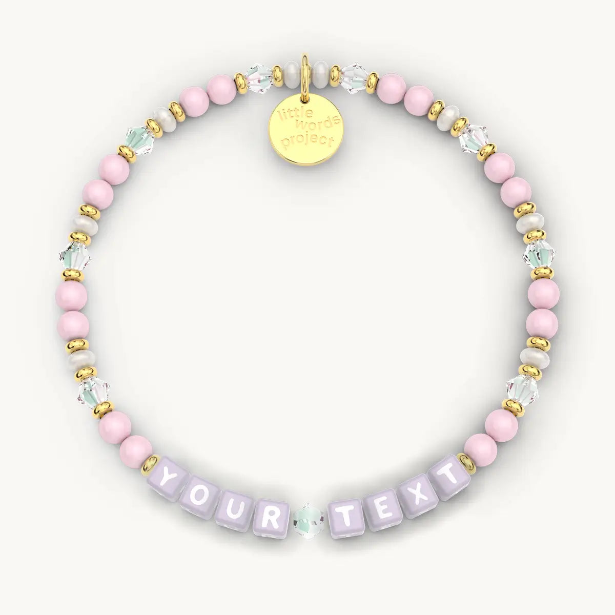Personalized beaded bracelet with 'Your Text' letters and gold tag on a white background