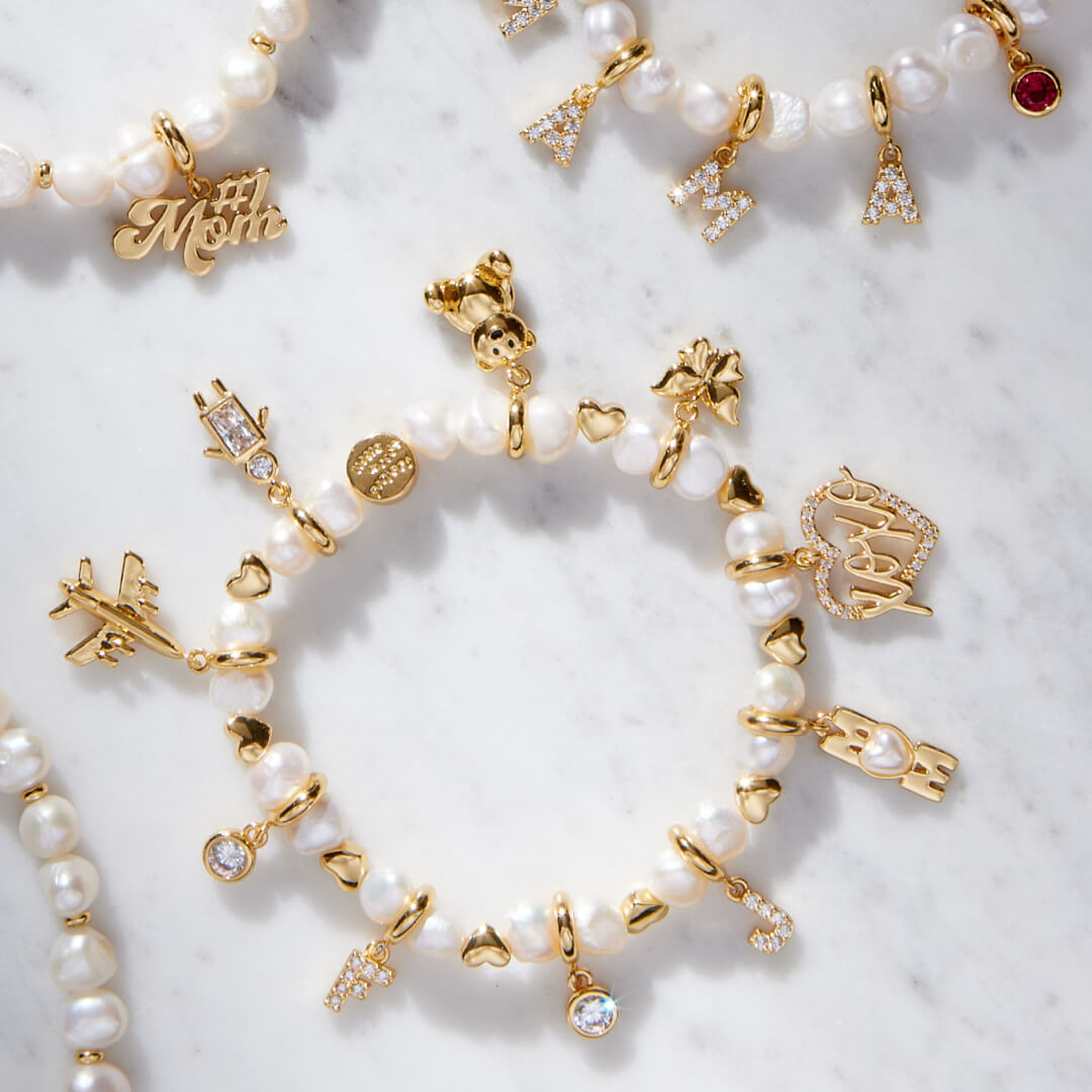 White Hearts by the Pearl Base Bracelet with Charms