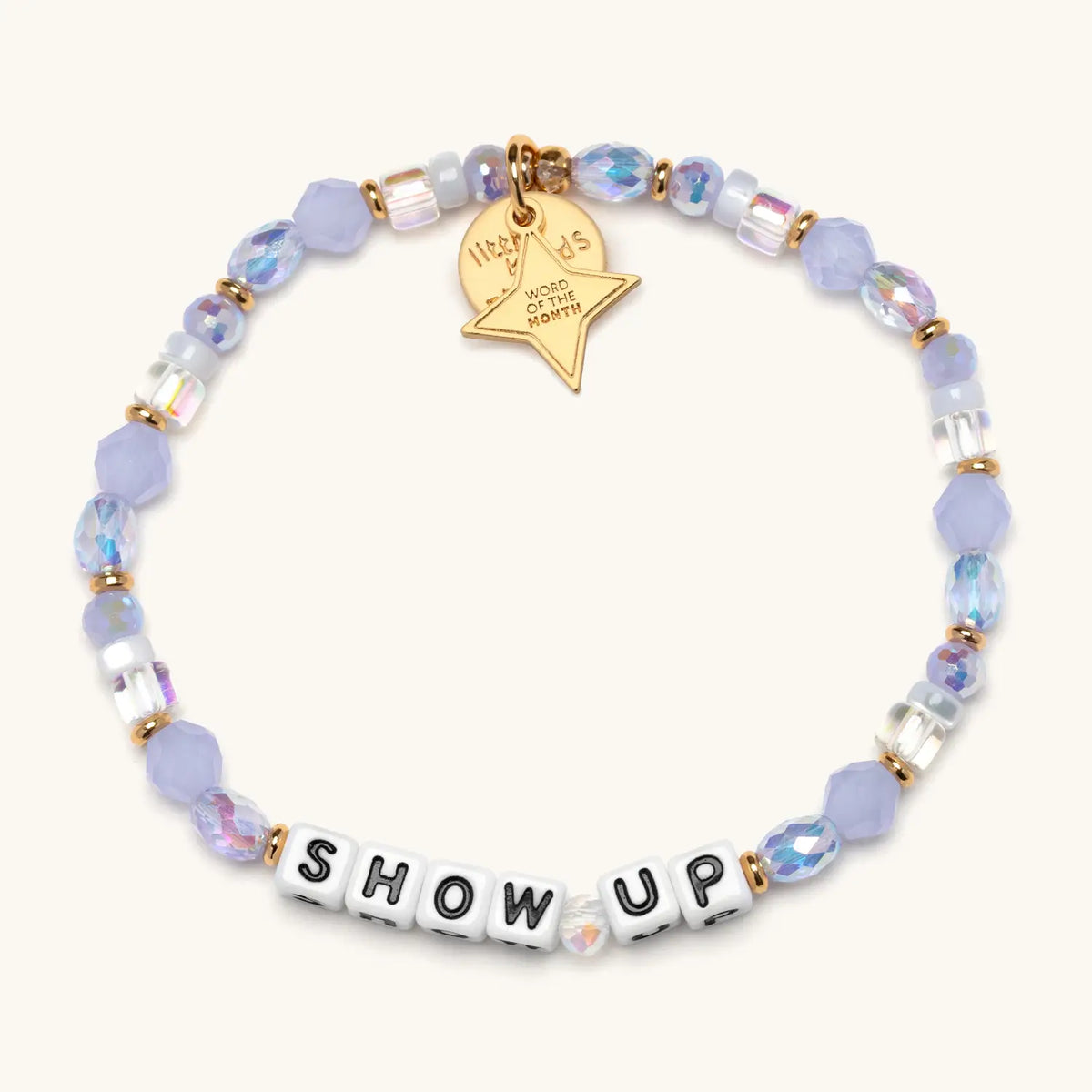Show Up bracelet with white letter beads and a gold tag, from the Six Months of Intention set