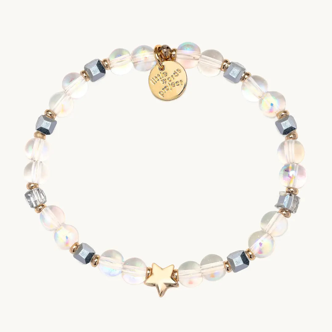 Bracelet with beads and gold star on a white background