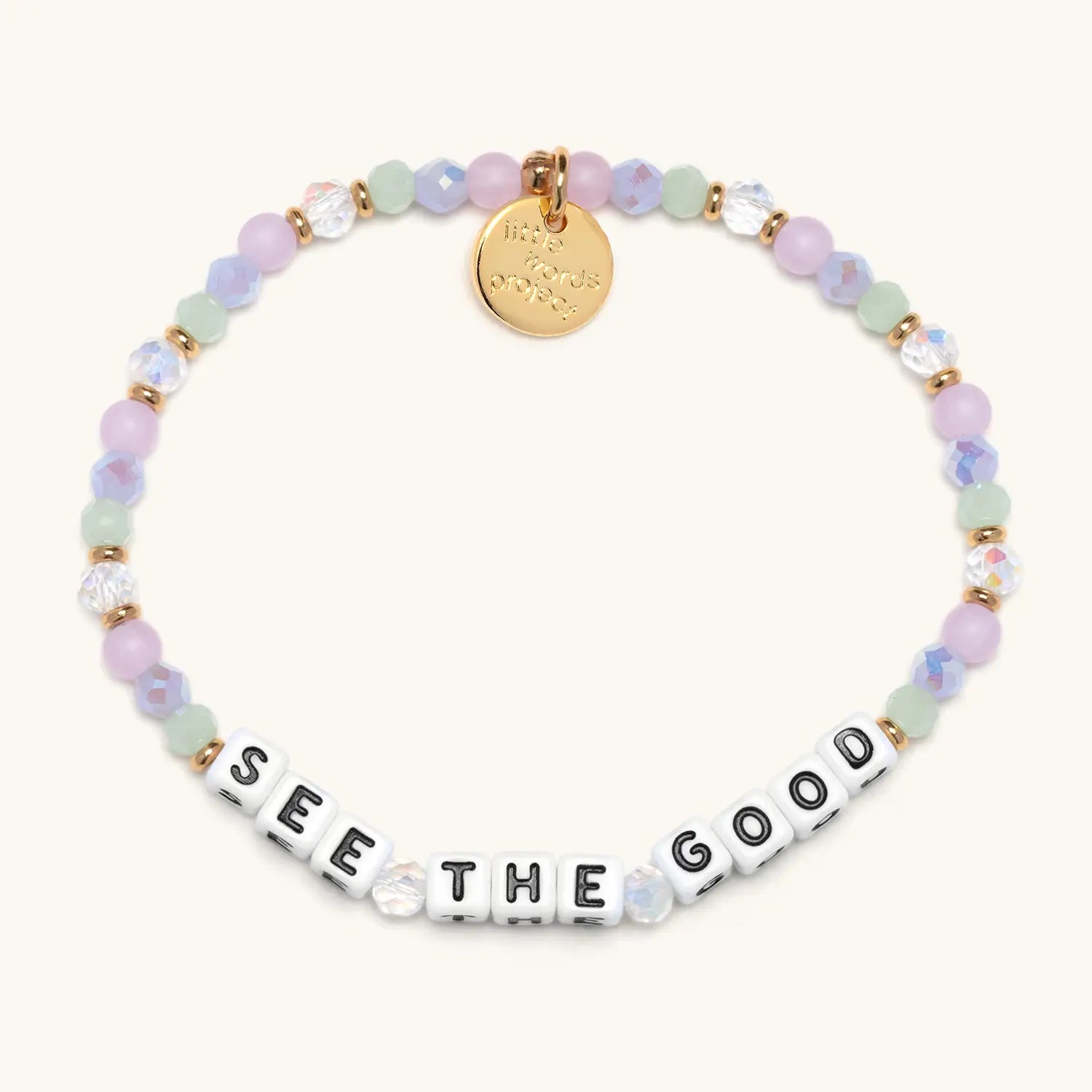 Bracelet with pastel beads and 'SEE THE GOOD' message on a white background