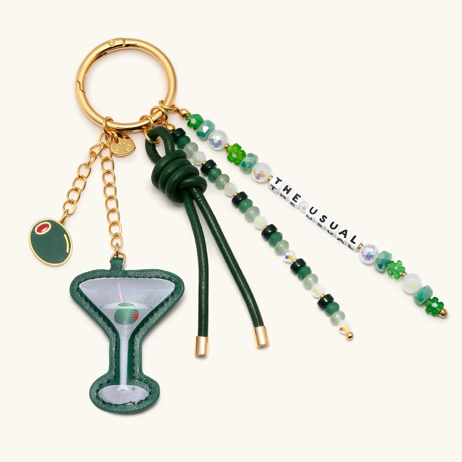 Keychain with martini glass charm on a white background