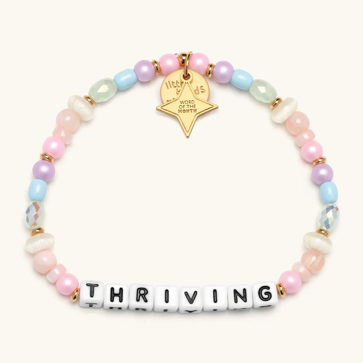 Thriving bracelet with multicolored beads and white letter beads, from the Six Months of Intention set