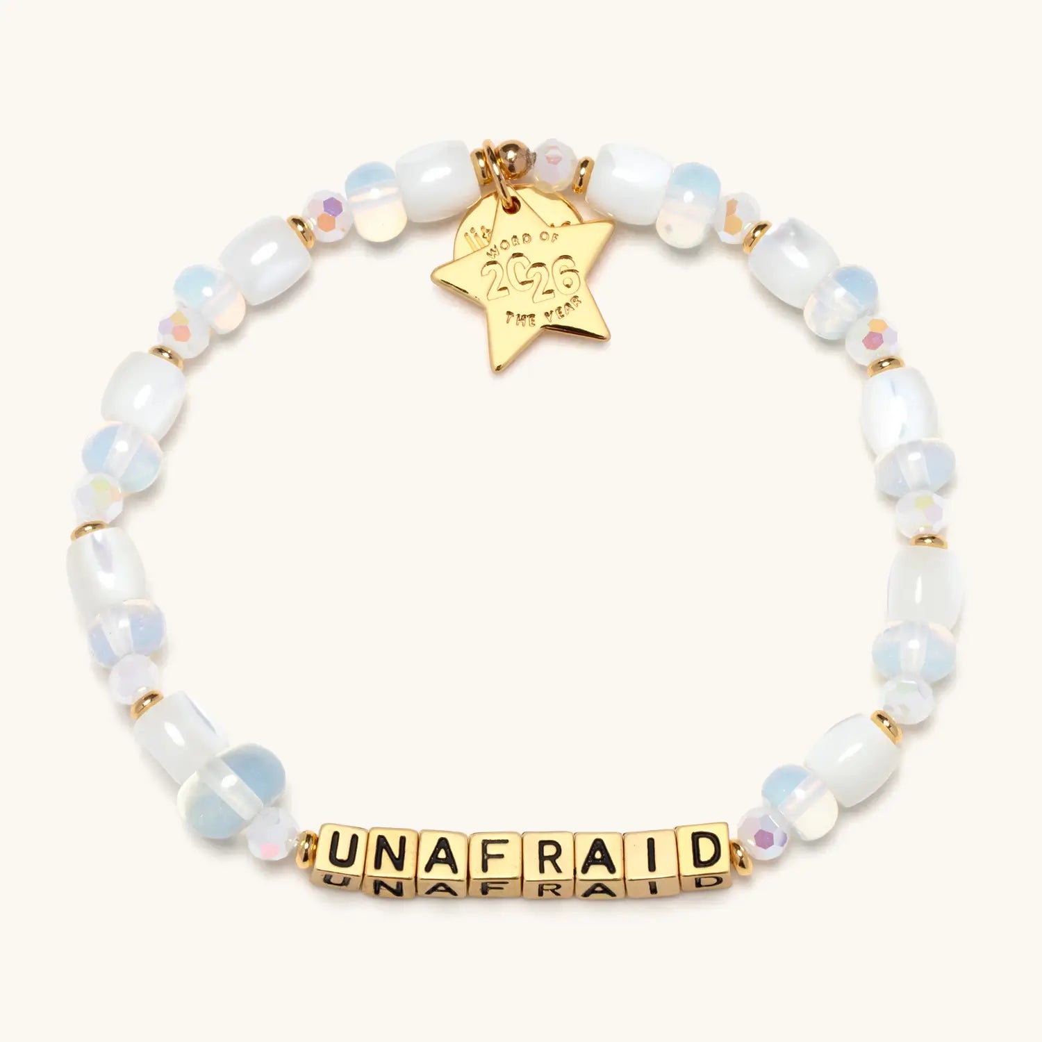 Bracelet with 'UNAFRAID' and gold star tag on a white background