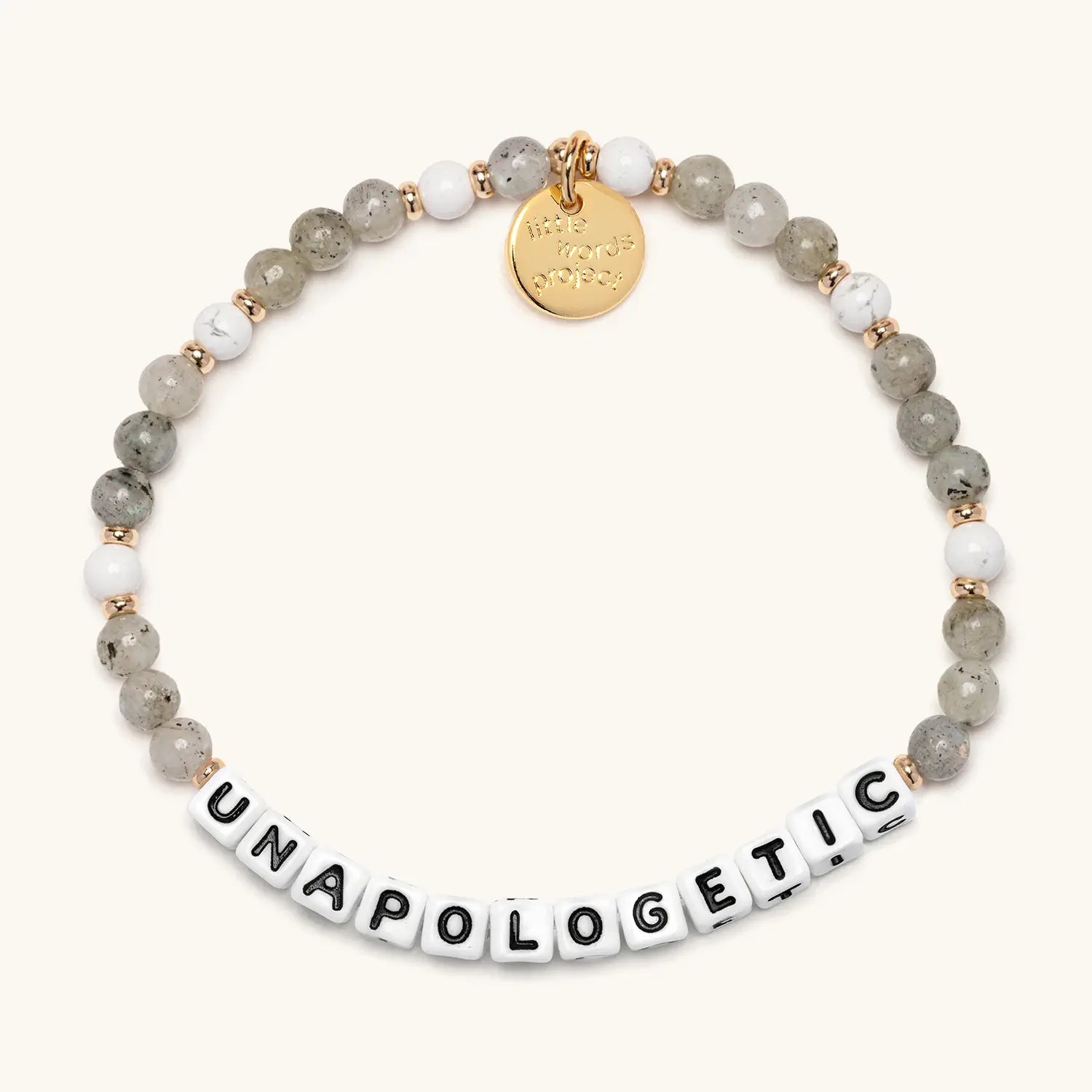 Bracelet with beads and a gold tag on a white background