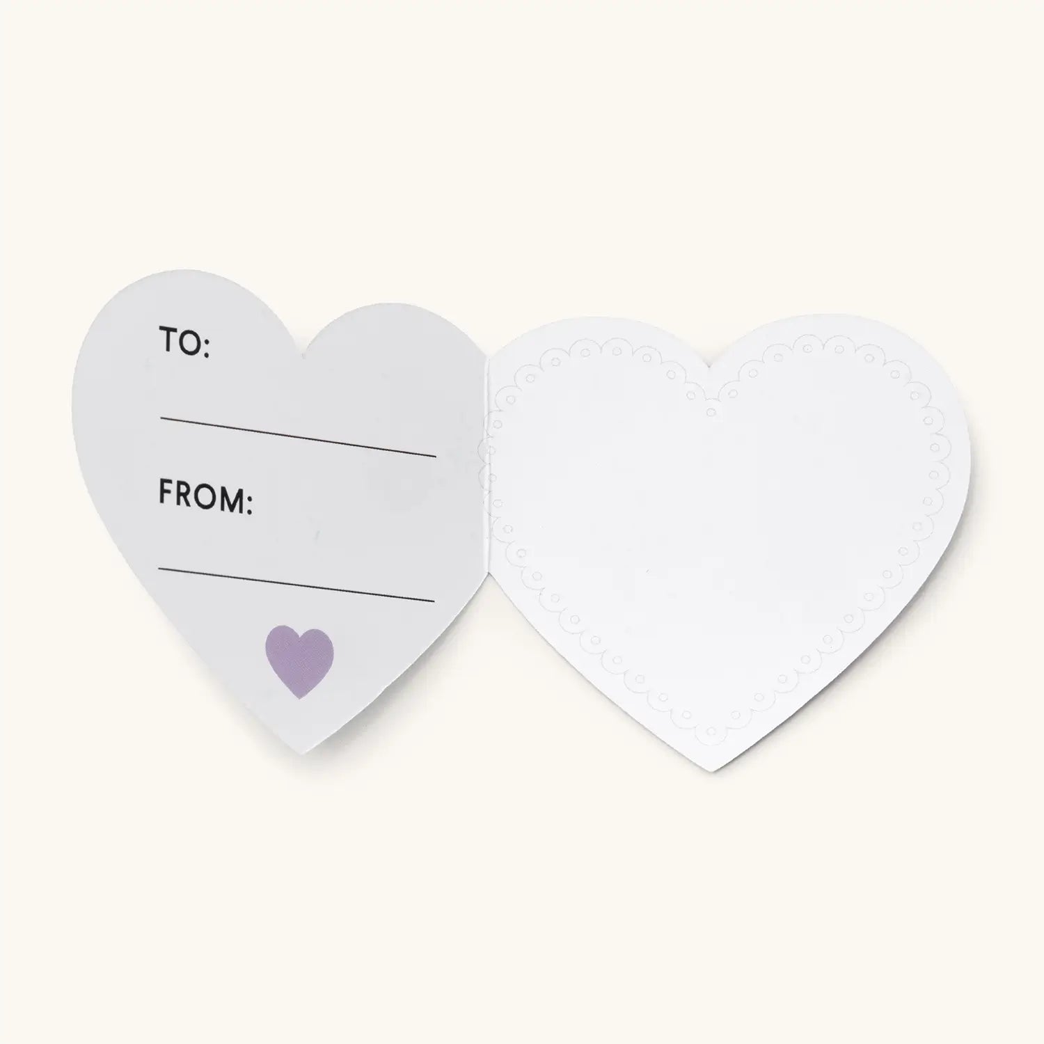 Heart-shaped gift tag with 'To' and 'From' fields on a white background