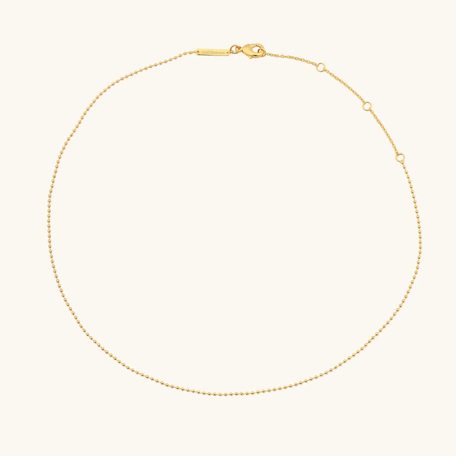 Gold necklace on a white background