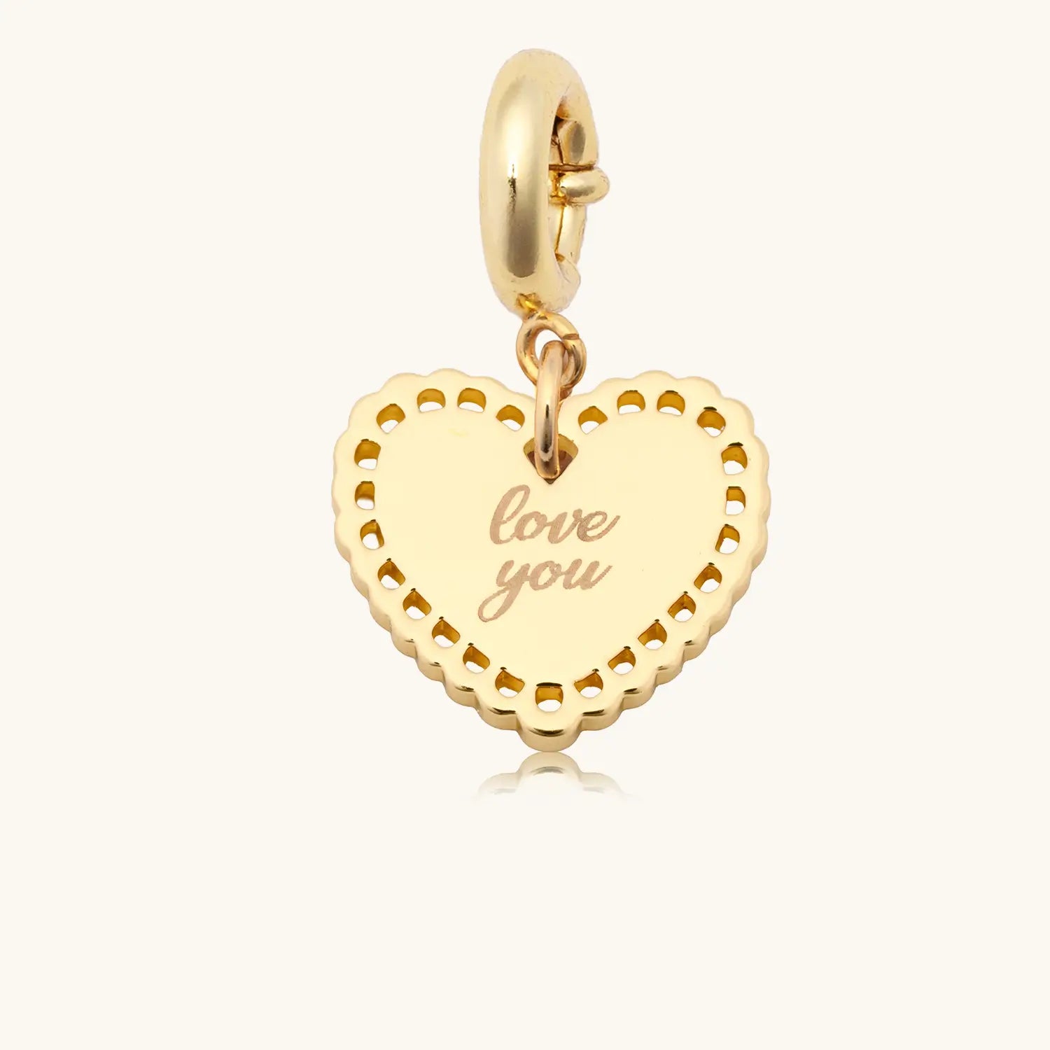 Gold heart-shaped pendant with 'love you' engraving on a white background